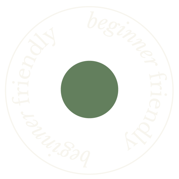 A circular design with a black background, green central circle, and white text that reads 'beginner friendly boxer friendly beginner' arranged around the circle.