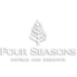 Logo de Four Seasons Hotels and Resorts avec un arbre stylisé blanc sur fond noir.
