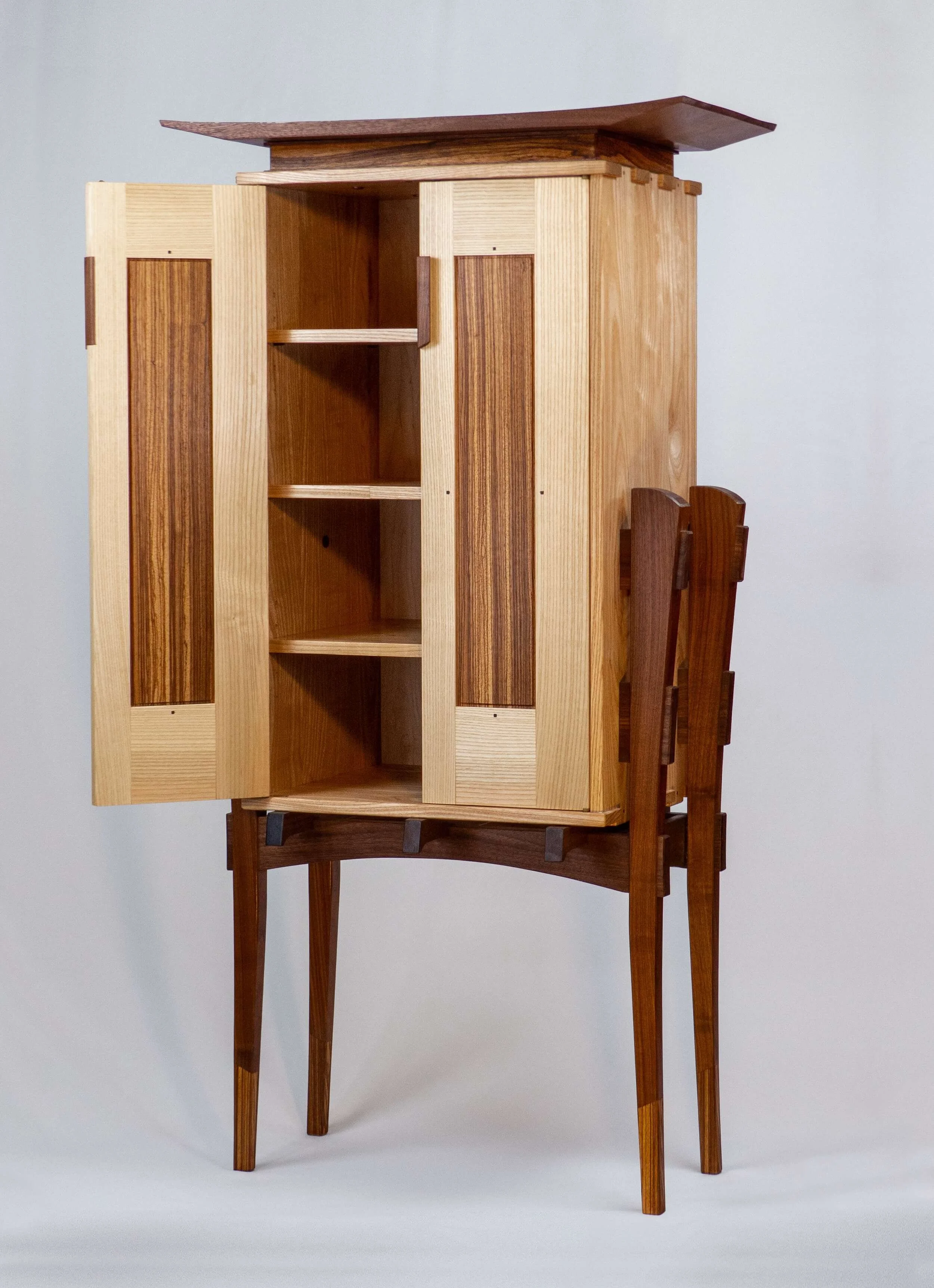 Cabinet-on-stand-zebrawood-side-open.jpg
