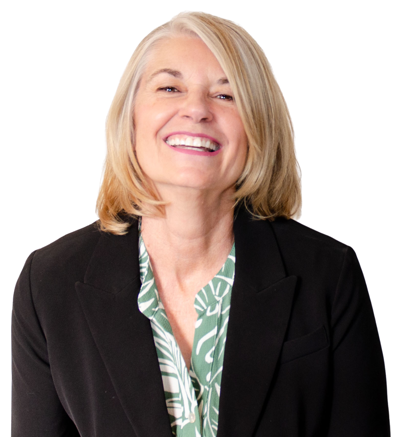 A smiling middle-aged woman with shoulder-length blond hair, wearing a black blazer over a green and white patterned blouse.