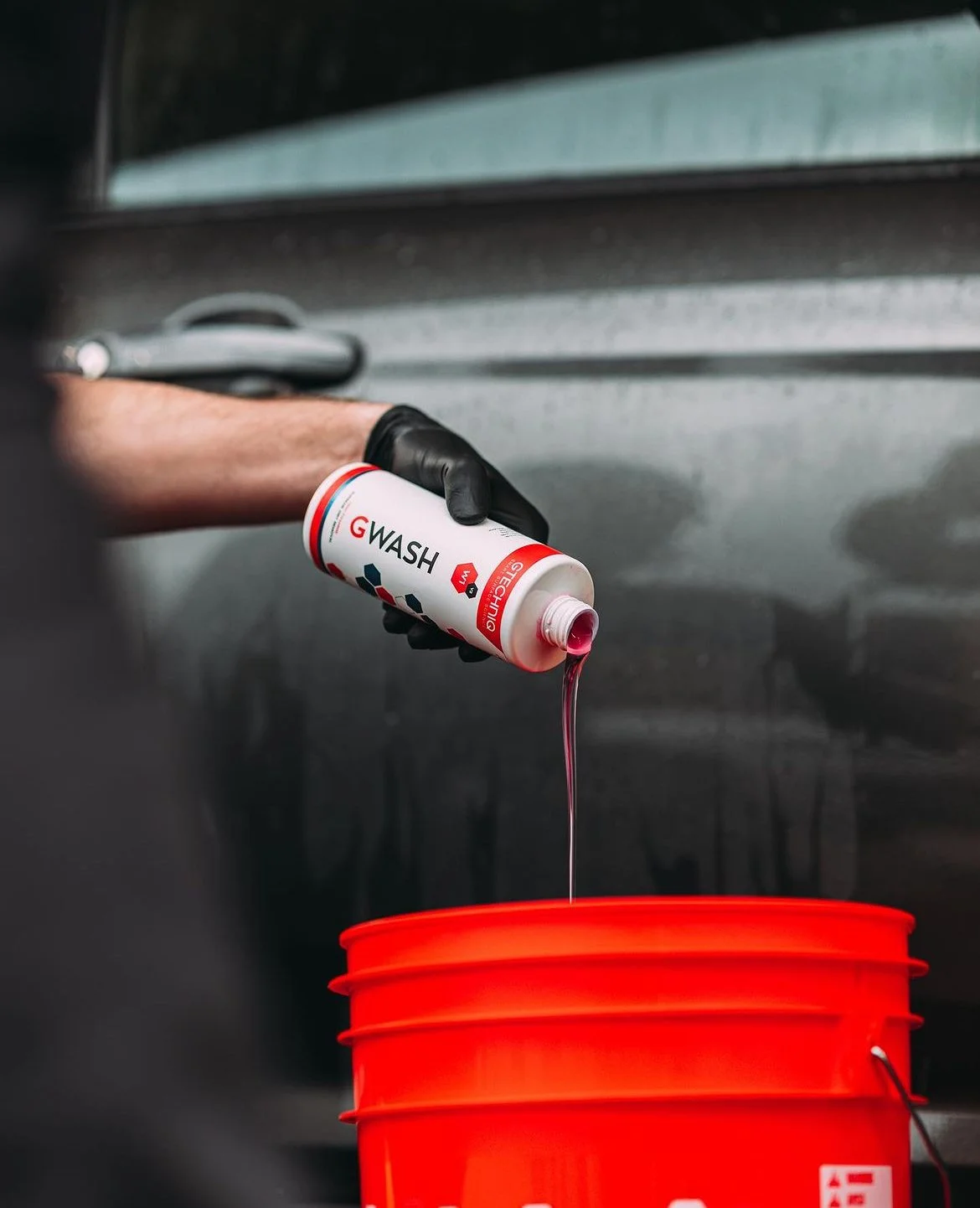 Gtechniq GWash ph-neautral car soap being poured into a bucket for a hand wash in Waterloo ON.