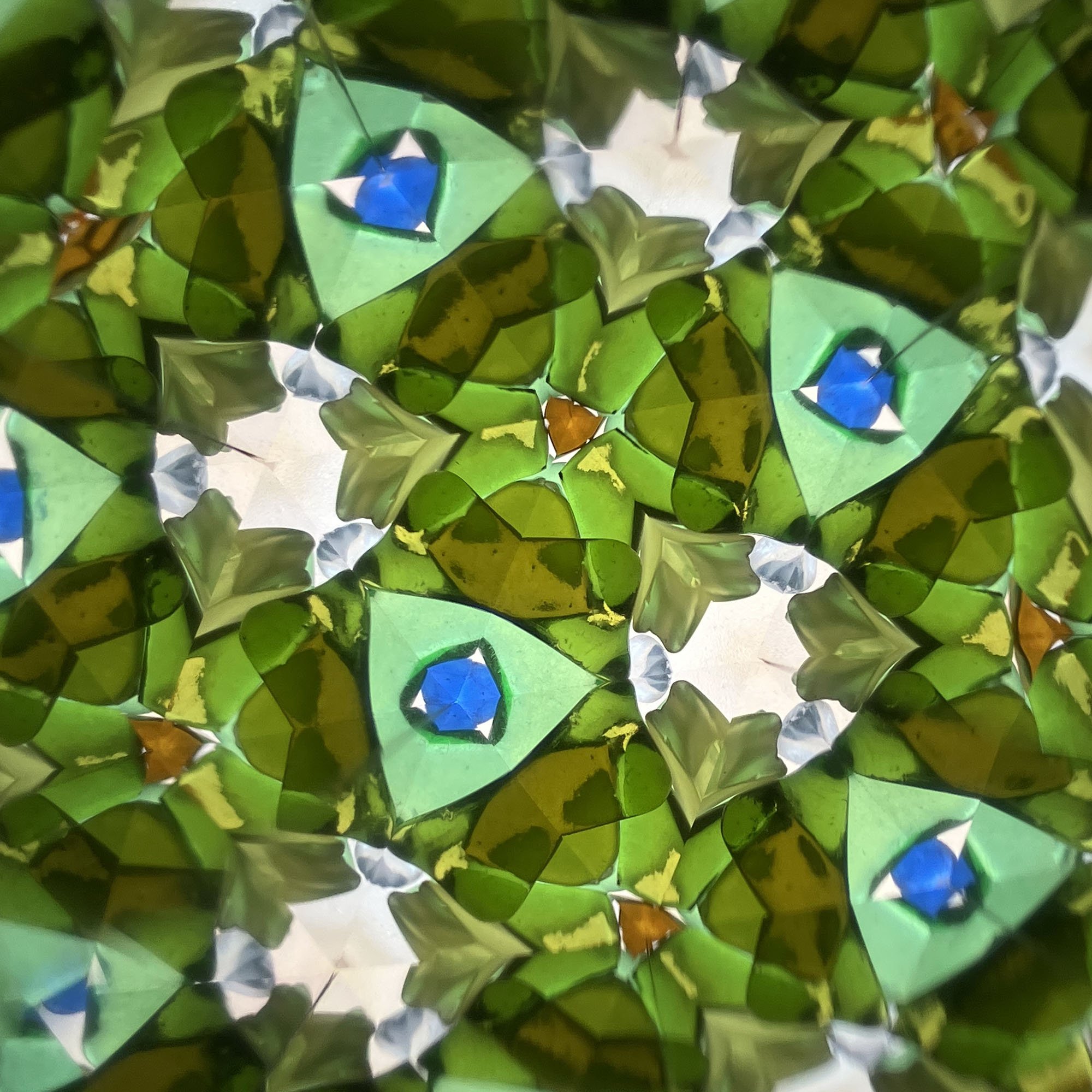  Vibrant green and turquoise kaleidoscope geometry reflecting recycled glass textures and spring-inspired colors. 