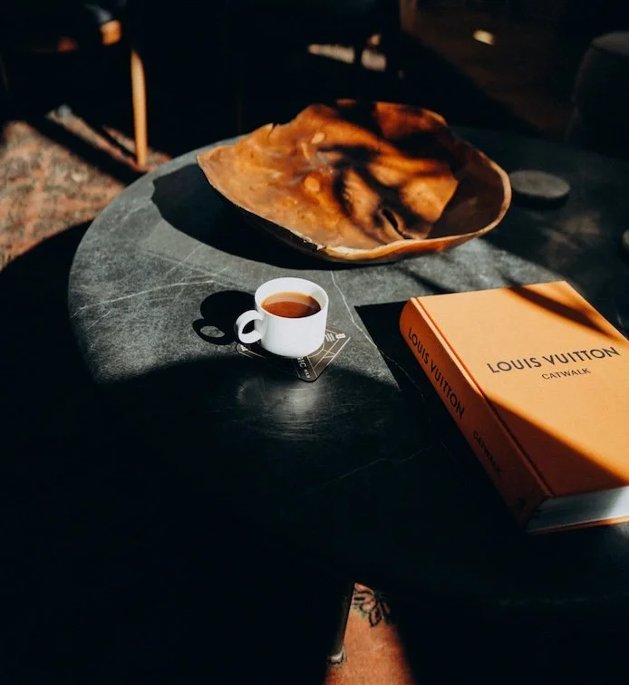 Coffee on a black ottoman