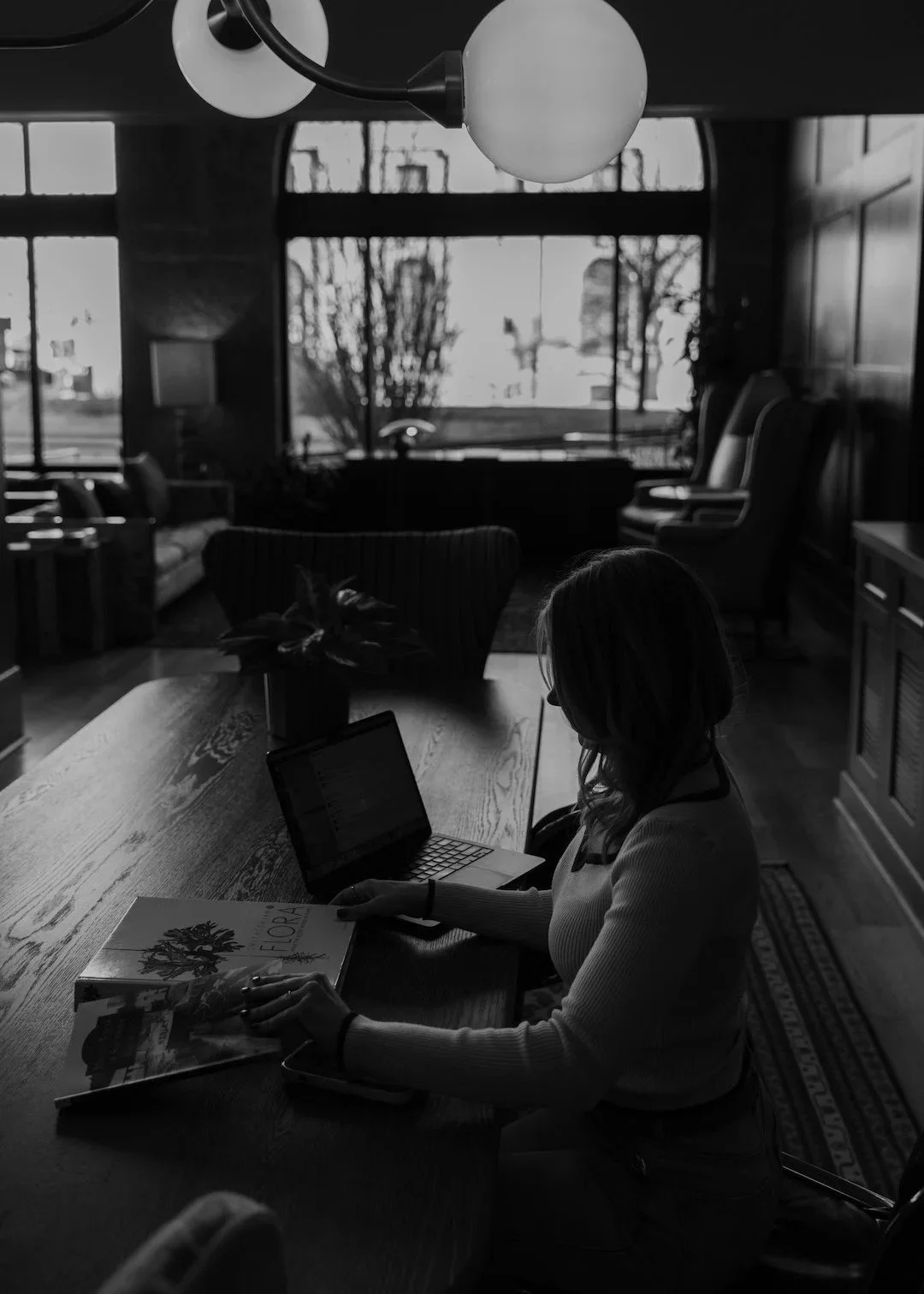 A black and white photo of Bonnie in a restaurant