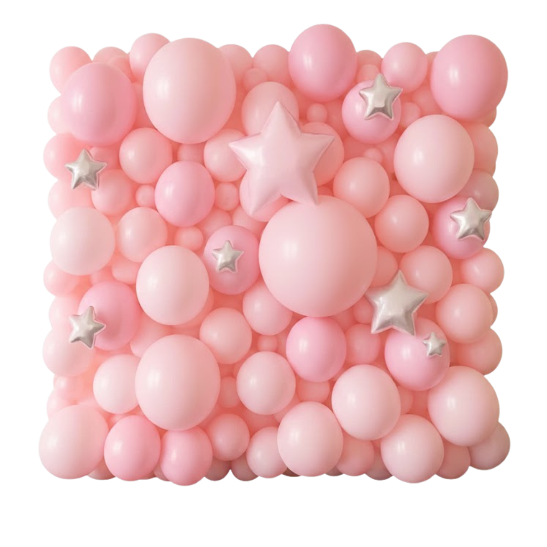 Pink balloon wall with star-shaped silver and pink balloons.