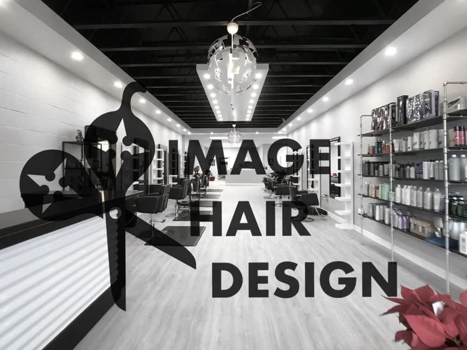 Interior of a modern hair salon with styling stations, shelves of hair products, and chandeliers, overlaid with text reading "Image Hair Design" and a scissors icon.