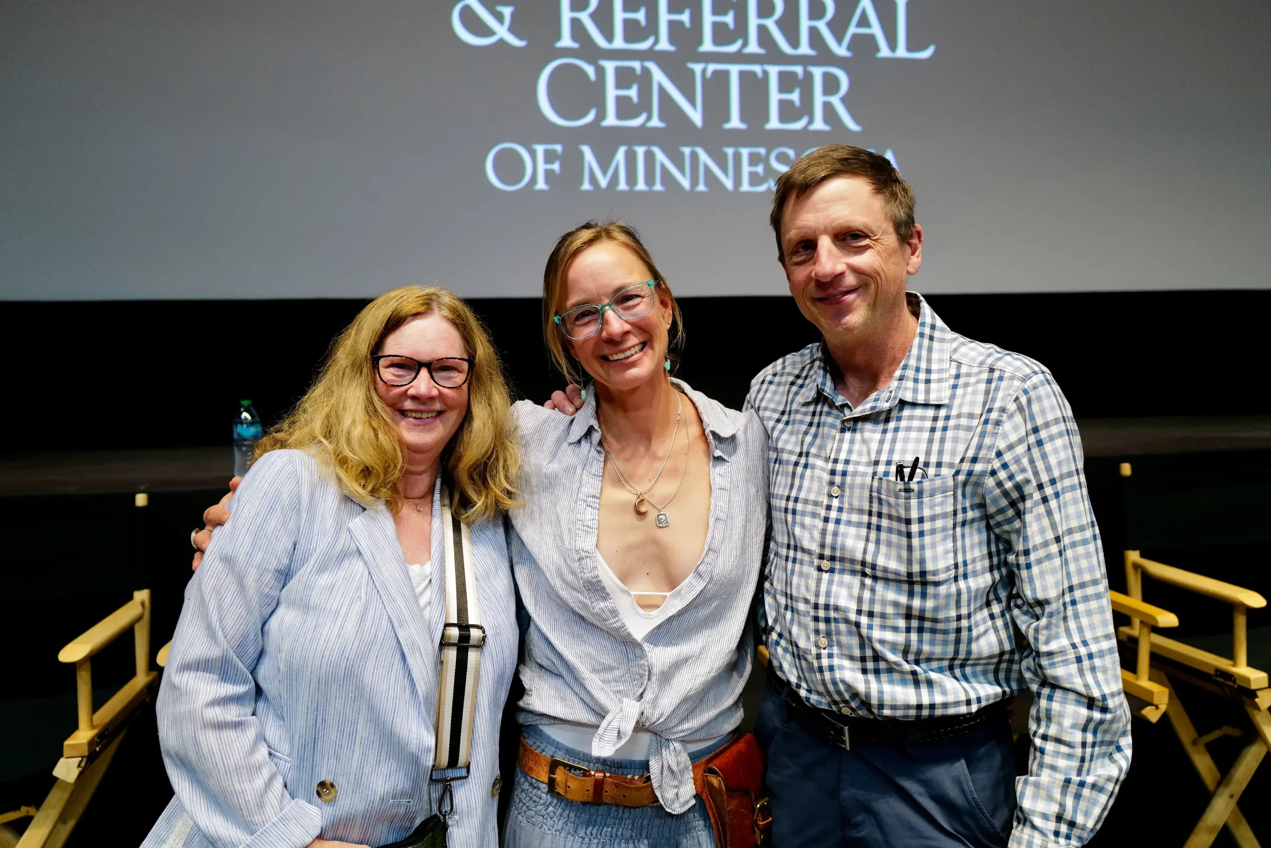 Three people posing for a picture at an End in Mind event.