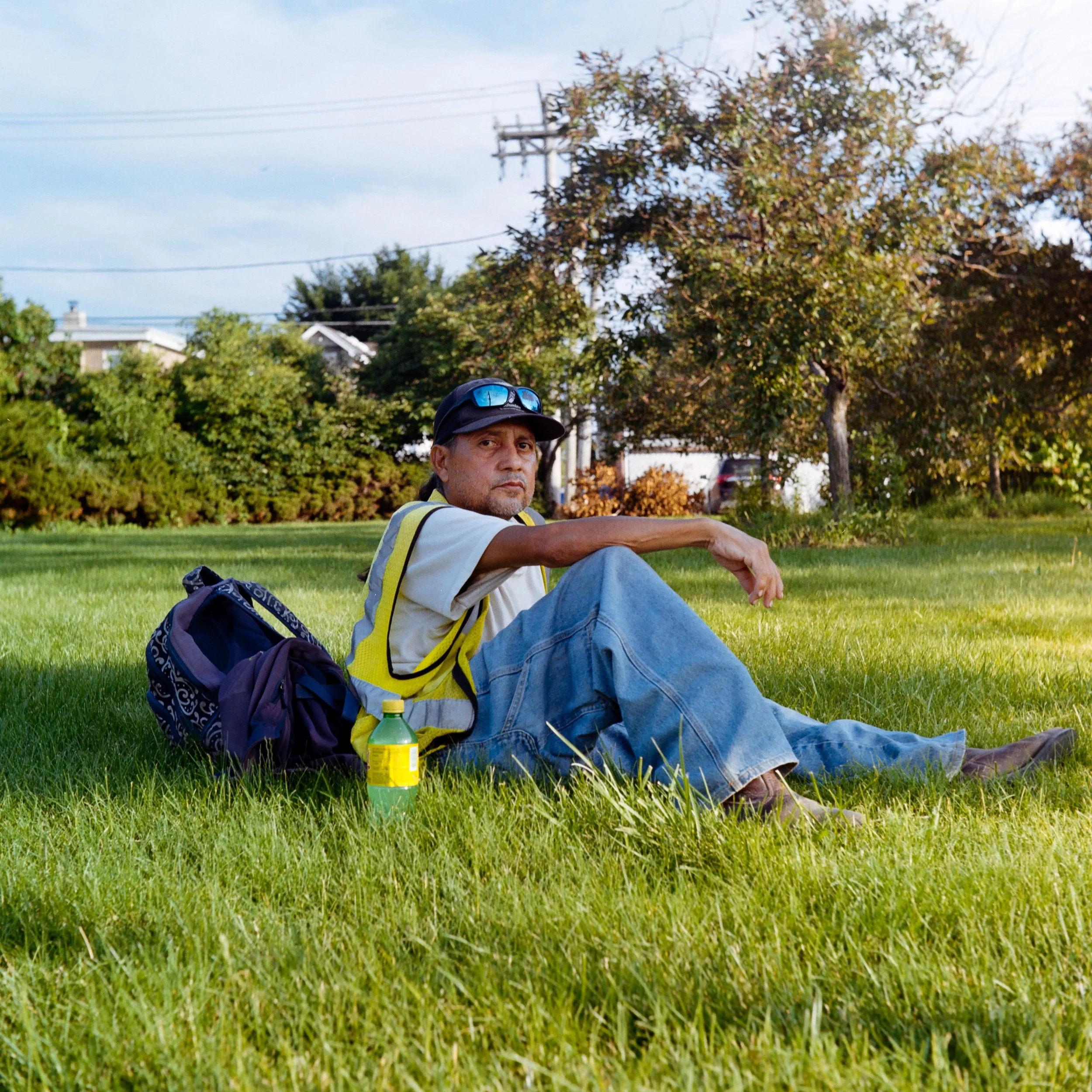 MIDWAY GARDENER AWAITS HIS BUS, 
A HUMID HEATWAVE ARISES 