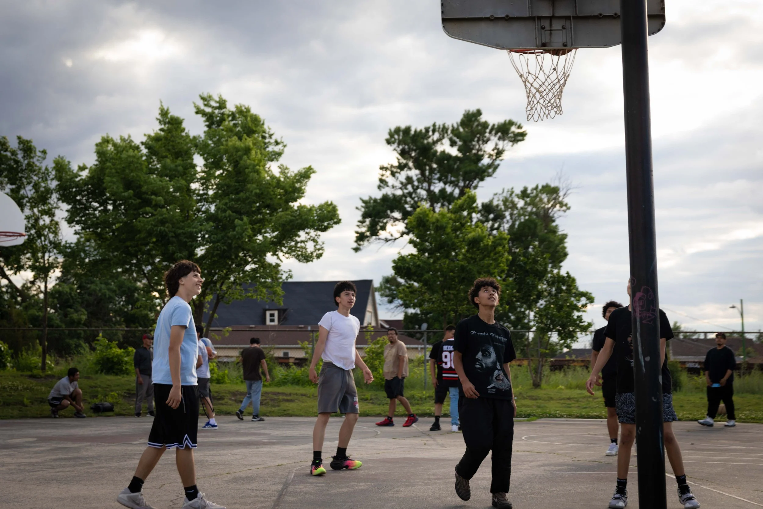 Young men look toward the basket during a pickup basketball game at Senka Park in the Gage Park neighborhood on the Southwest Side of Chicago on Wednesday, June 17, 2026. This photo is part of The Columbia Chronicle’s “77 Community Areas” project doc