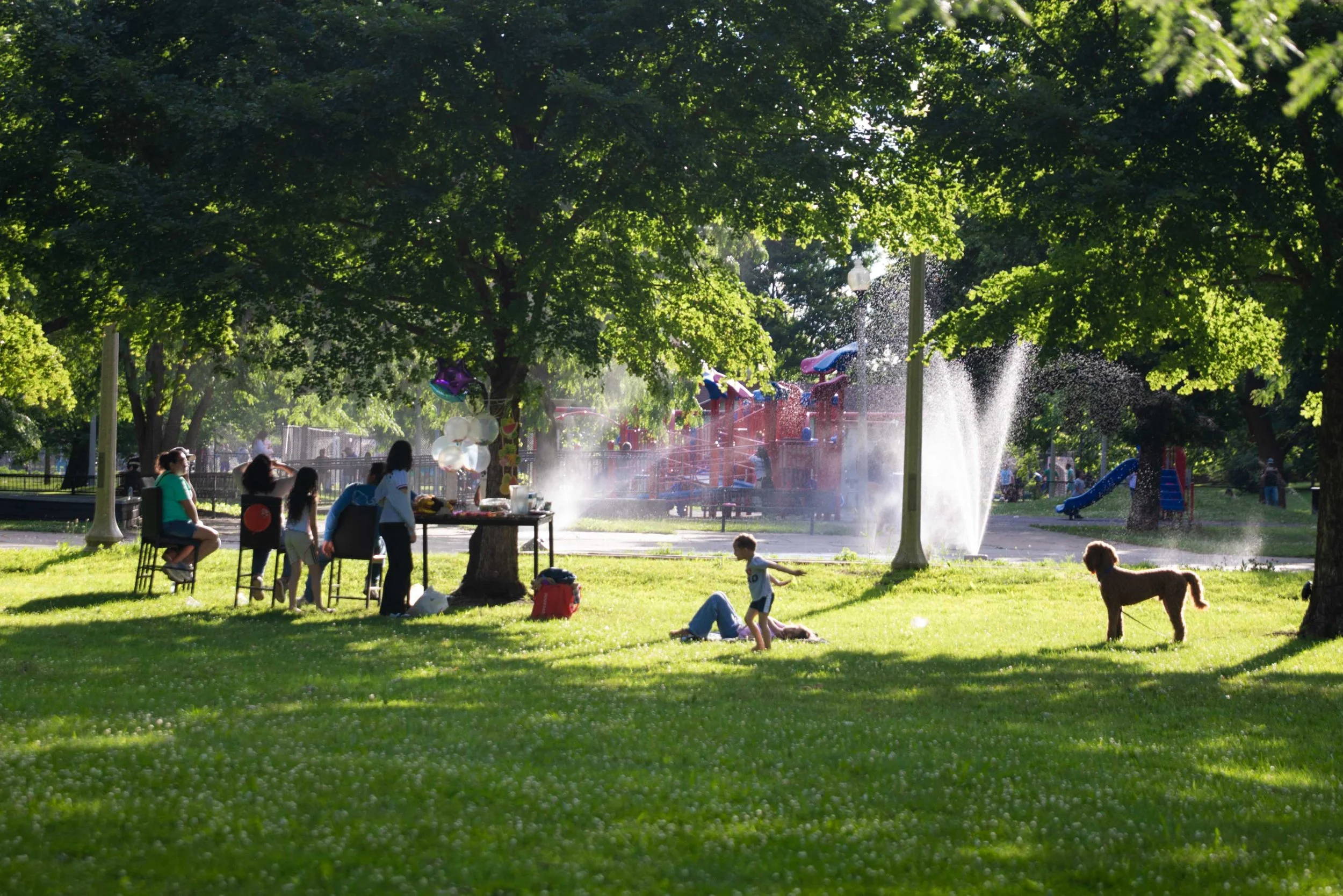 A group of people gather together at Marquette Park in the Chicago Lawn neighborhood on the Southwest Side of Chicago on Monday, June 13, 2026. Following intense storms and a severe weather outbreak that knocked out power across the South Side earlie