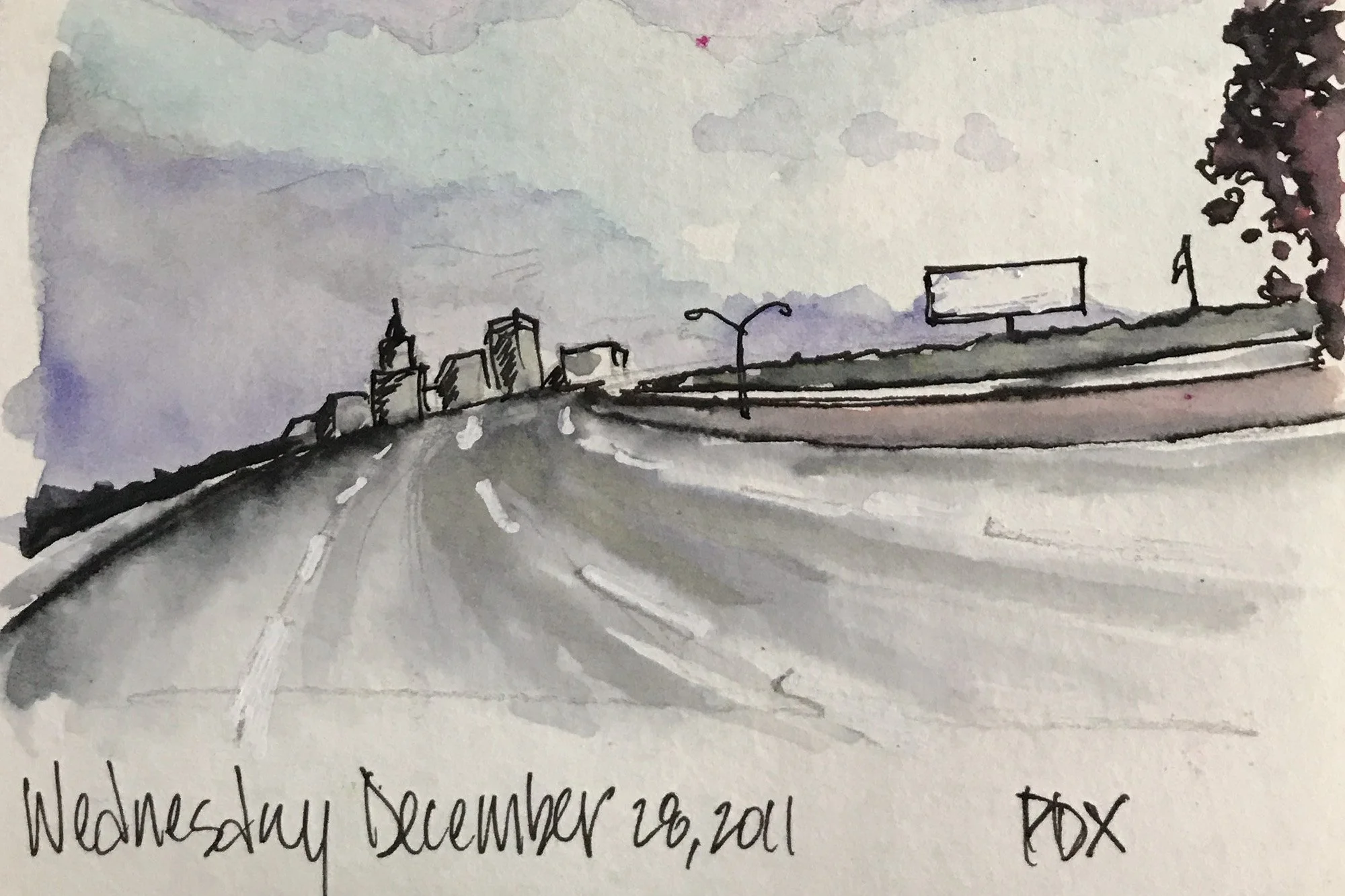 A watercolor painting of a cityscape viewed from a highway with a few tall buildings in the distance, a billboard on the right, and stormy clouds overhead. The date "Wednesday December 28, 2011" and the initials "PDX" are handwritten at the bottom.