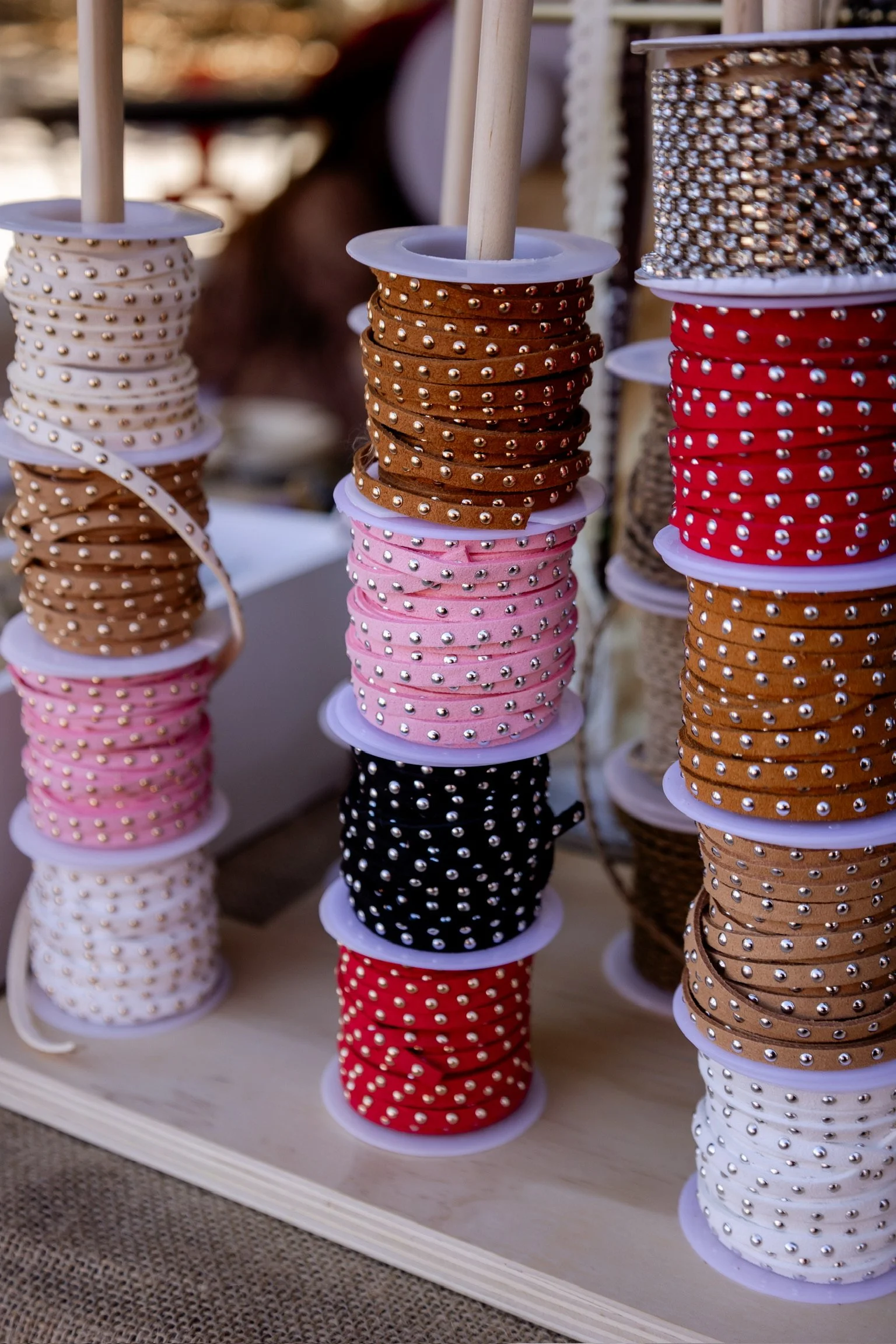 spools of studded suede for hats