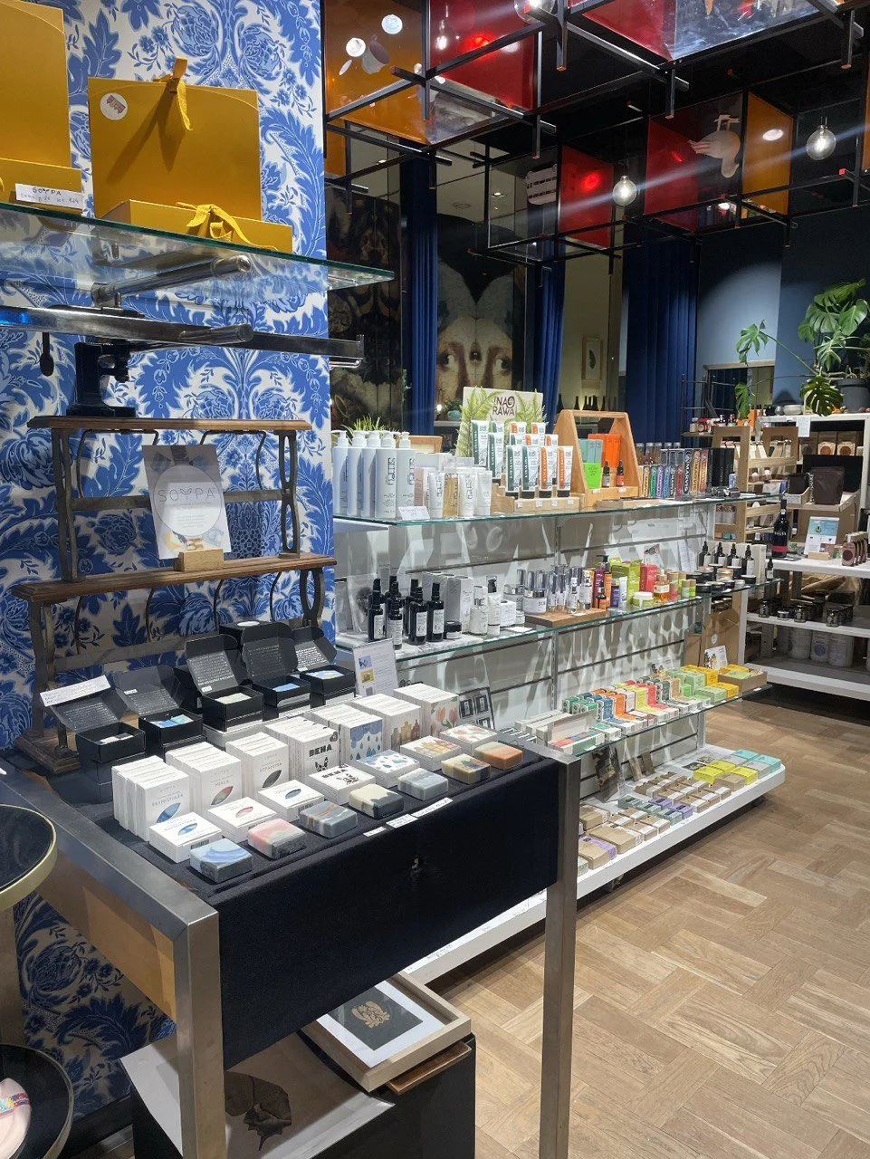 Street retail store with beauty products and floral interior — Amsterdam project by Nata Buro