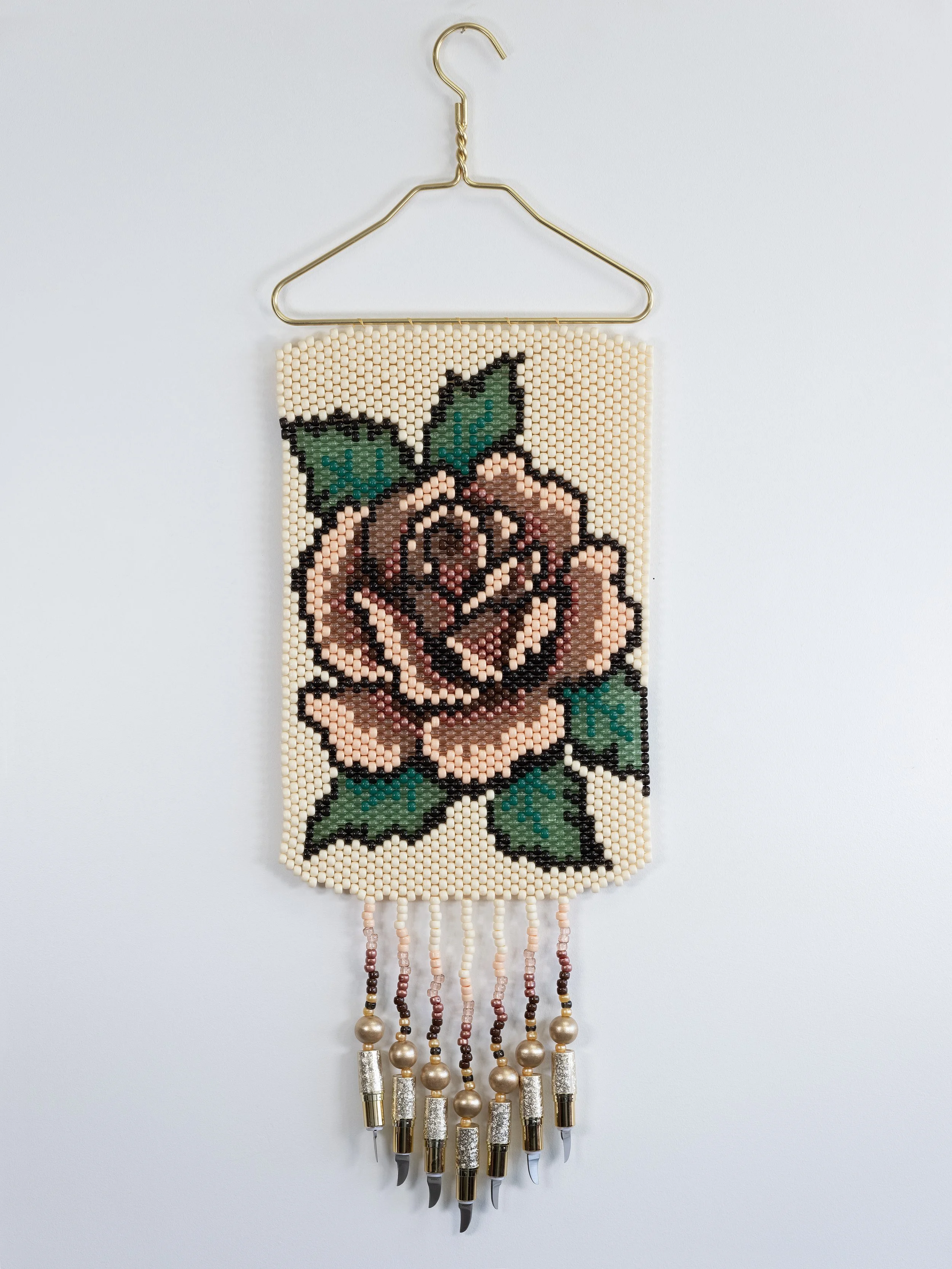 Deer Woman (peach),
Metal hanger, plastic and wood beads, lipstick knives, 12" x 36"