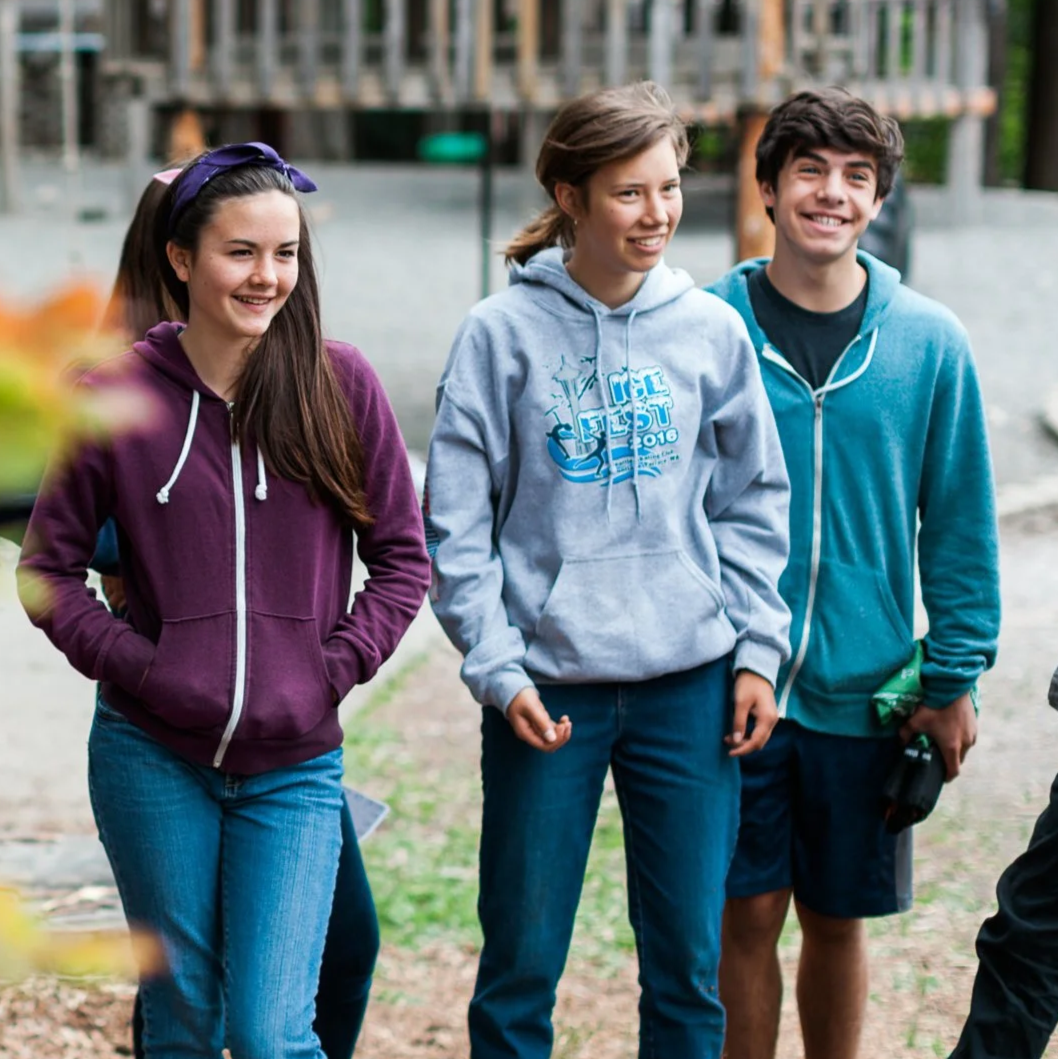 Older students smiling outdoors