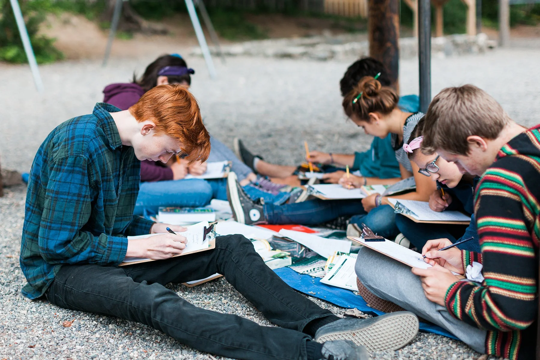 8th grade students studying outside