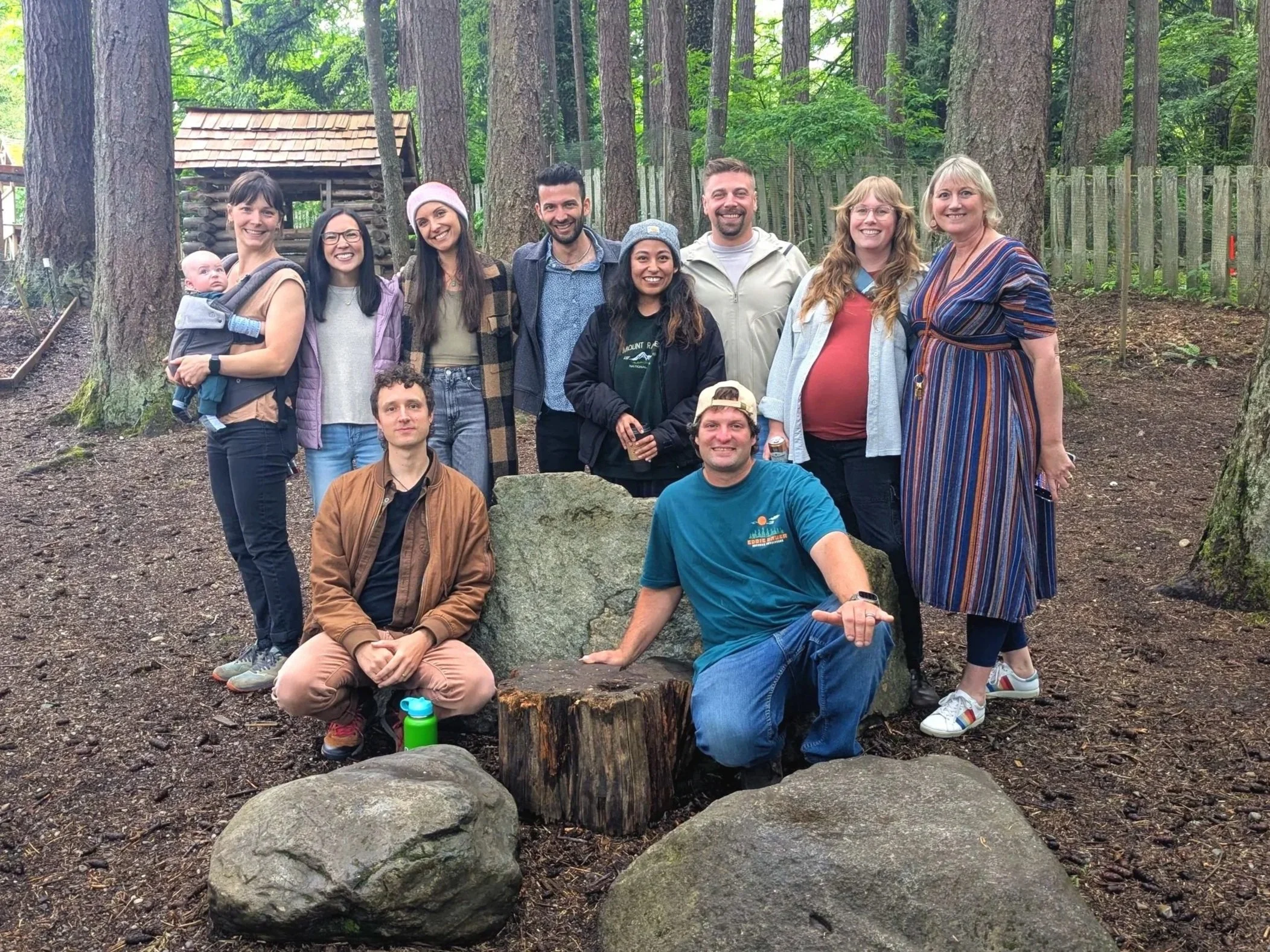 Group of WHWS 2005 alumni in woods on campus