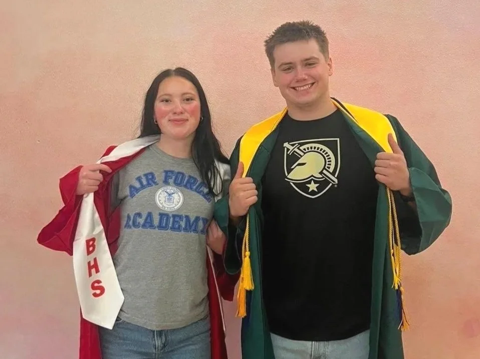 Graduates showing Air Force and Army shirts