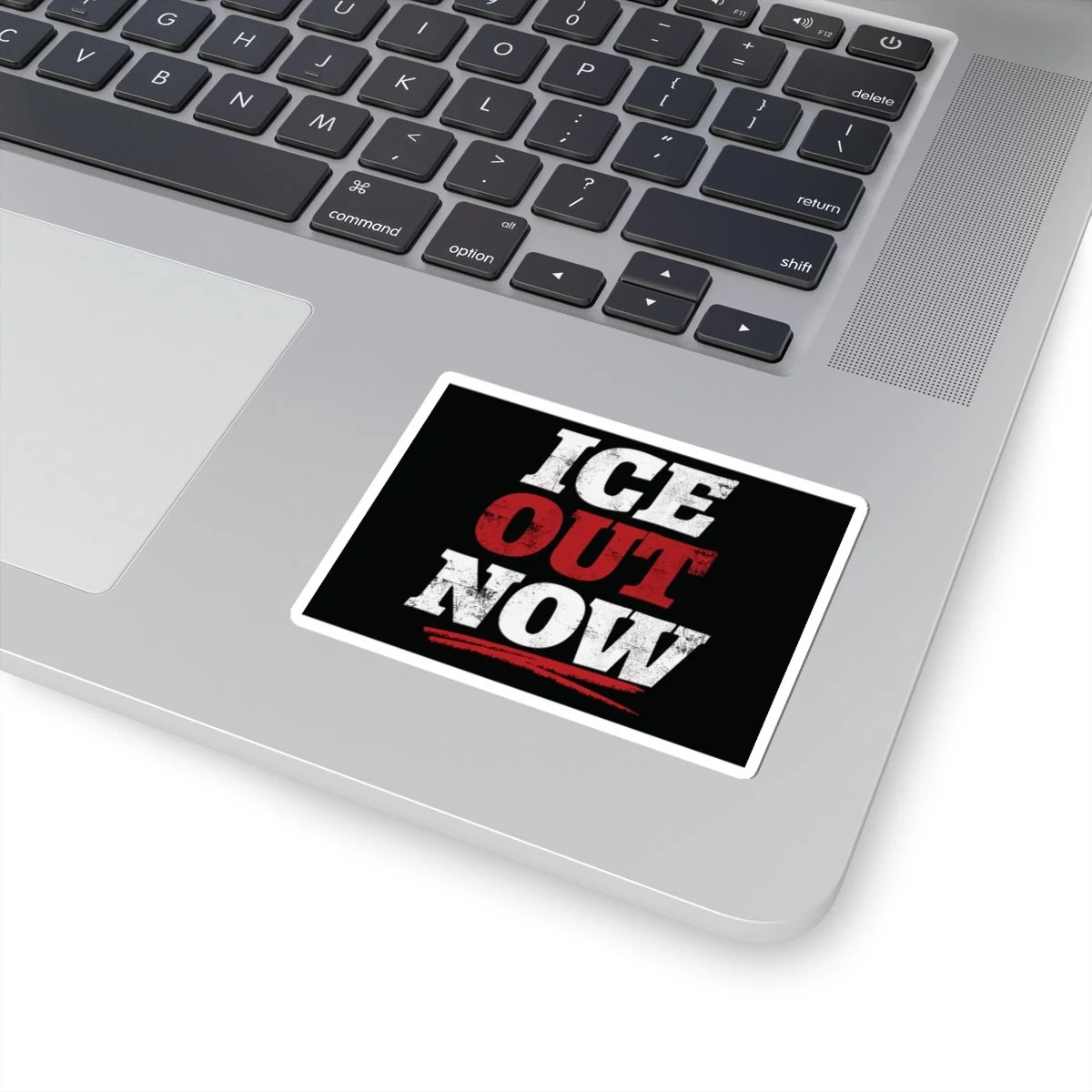 ICE OUT NOW sticker on a laptop