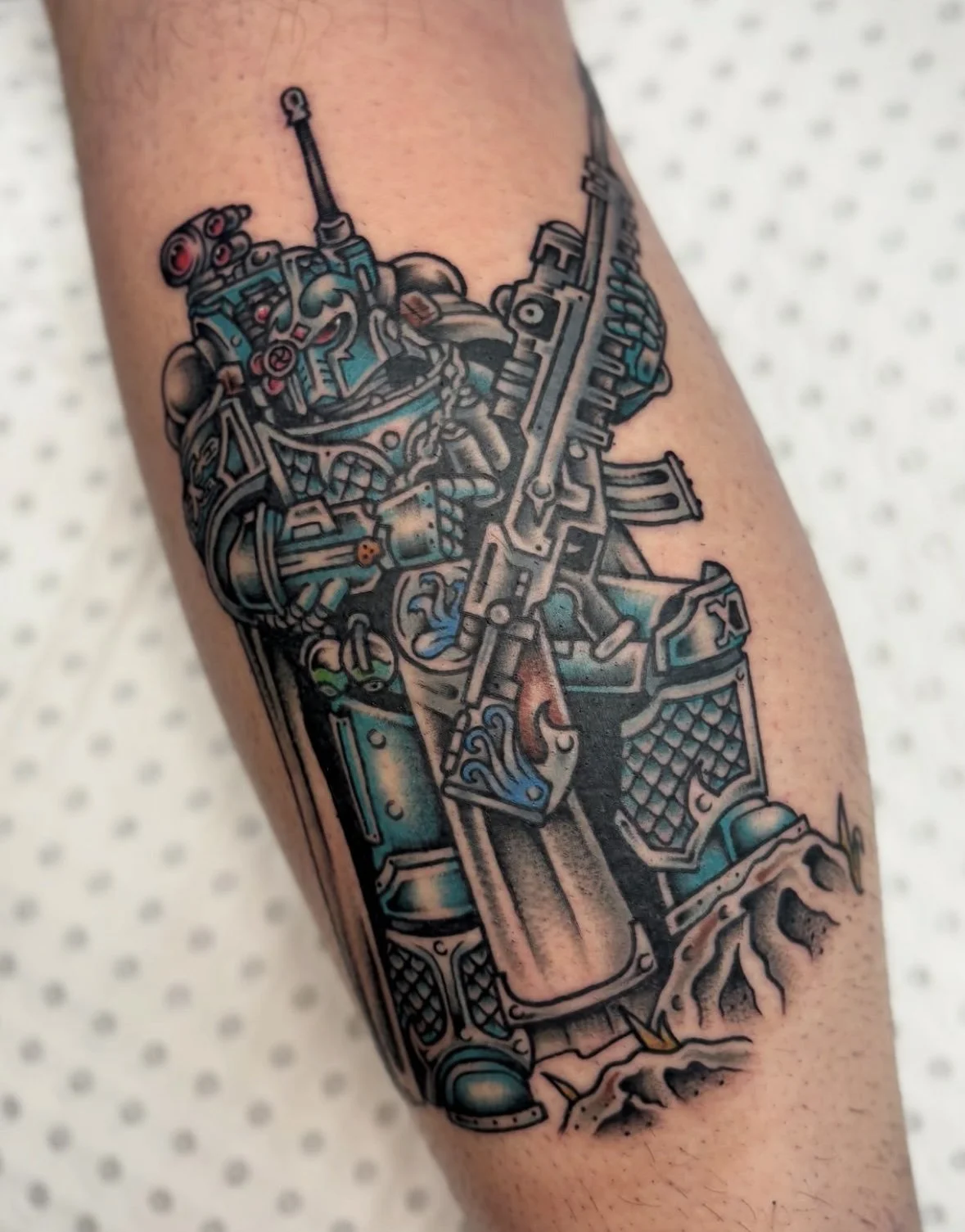 Colour Trad tattoo of a cyborg and gun by Brandy G