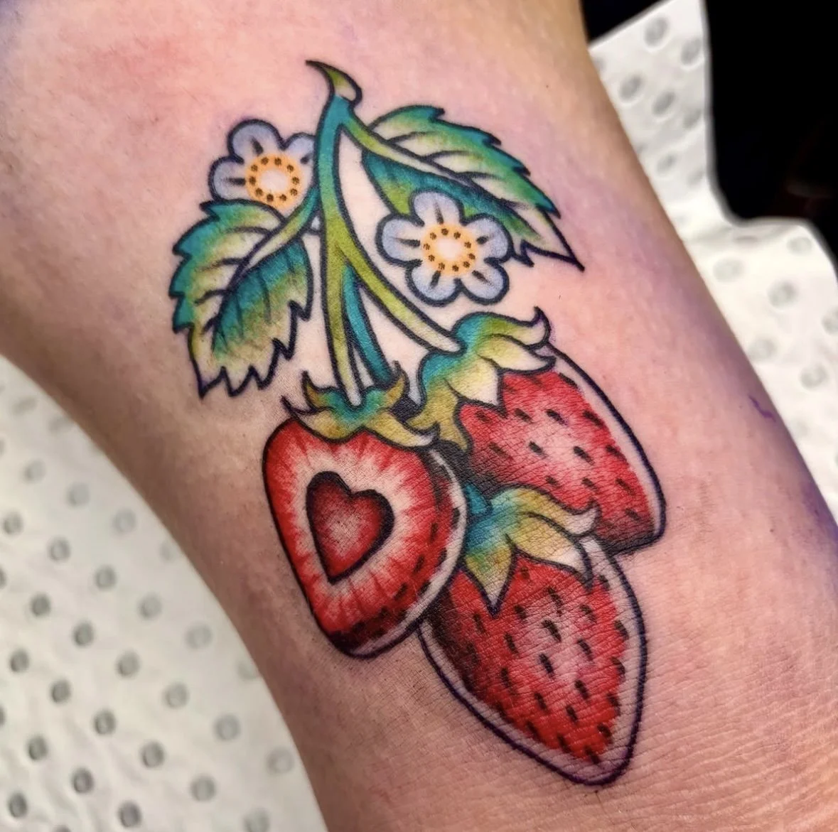 Colour Trad tattoo of strawberries by Brandy G