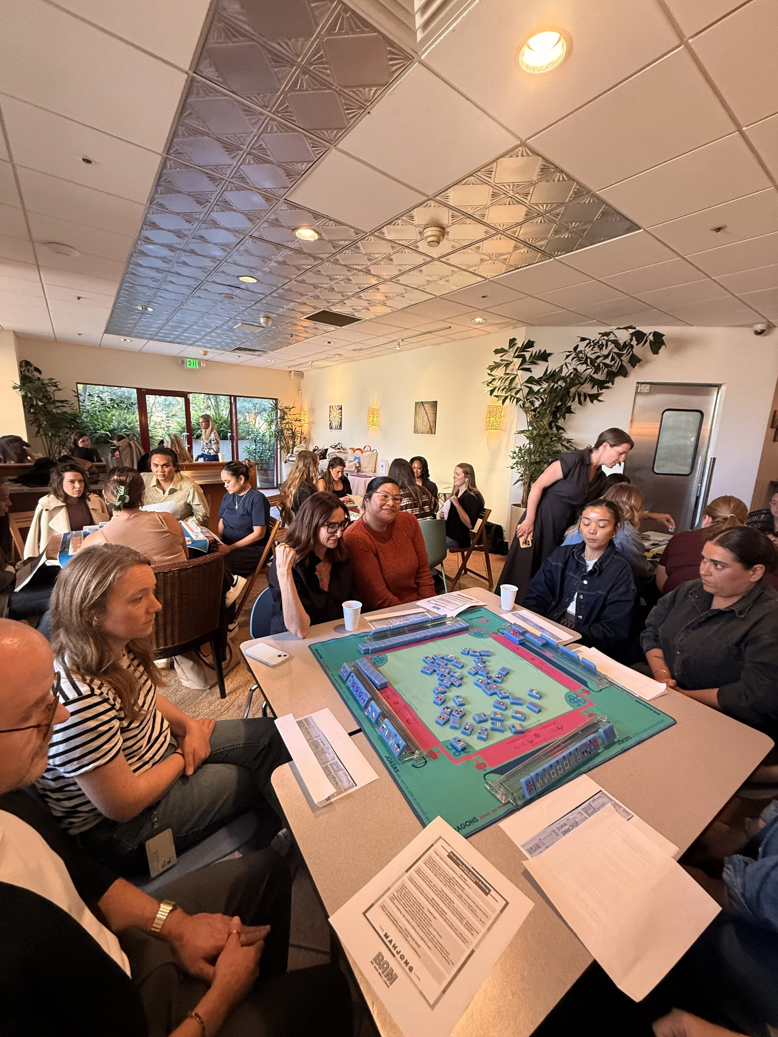 Group of people playing American Mahjong 
