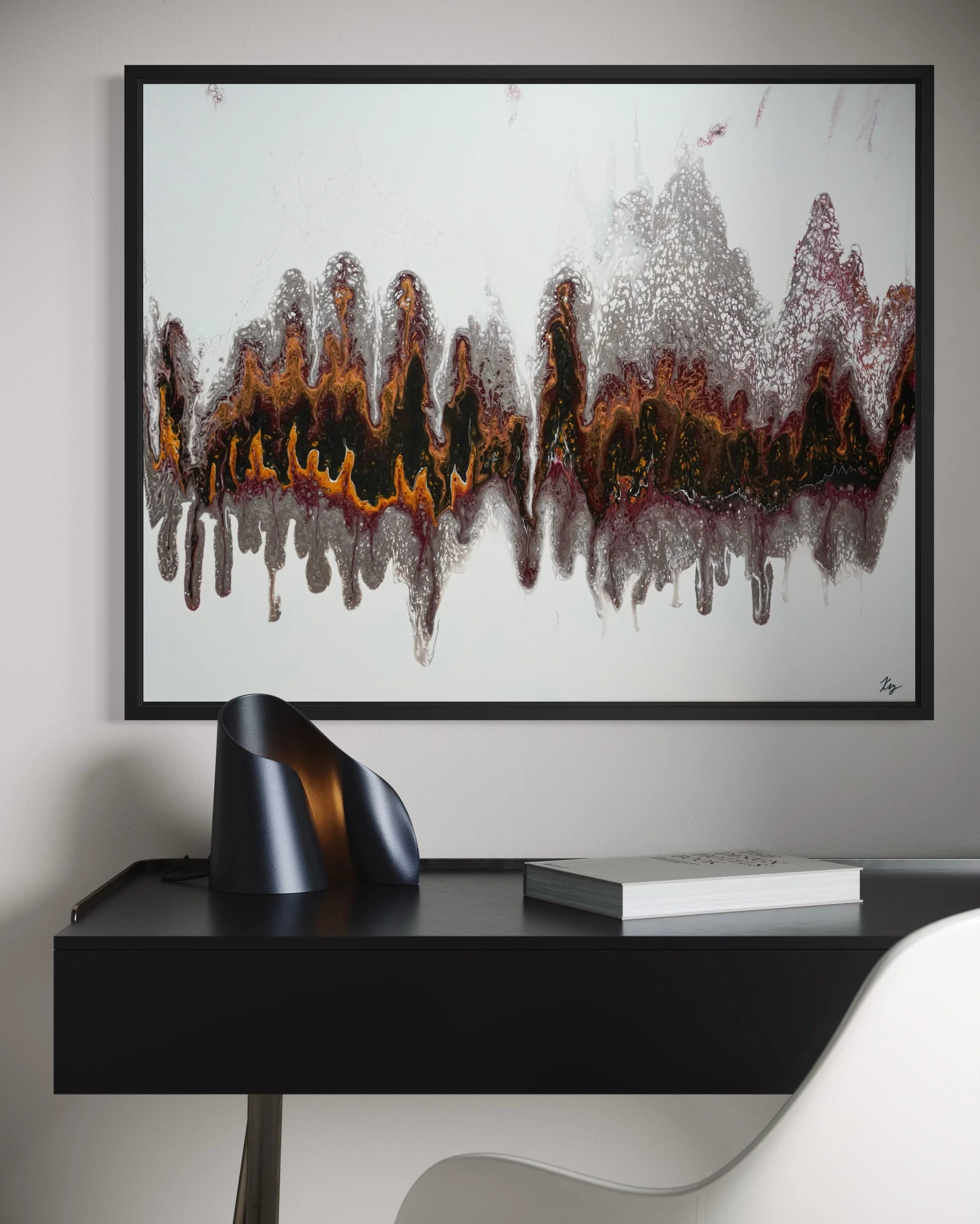 Abstract wall art with black, orange, and purple drips and patterns hanging above a black desk with a black desk lamp, a closed book, and a white chair in a minimalist room.