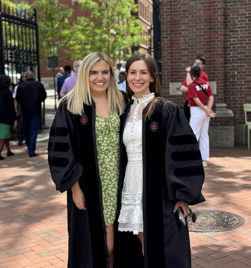 Kendall Ciesemier and Alessandra Biaggi in commencement robes at Harvard
