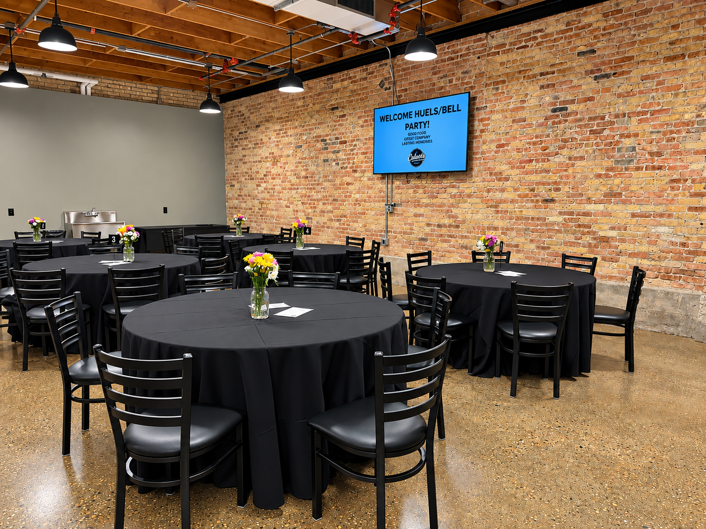 Classroom featuring large TV and live video feed