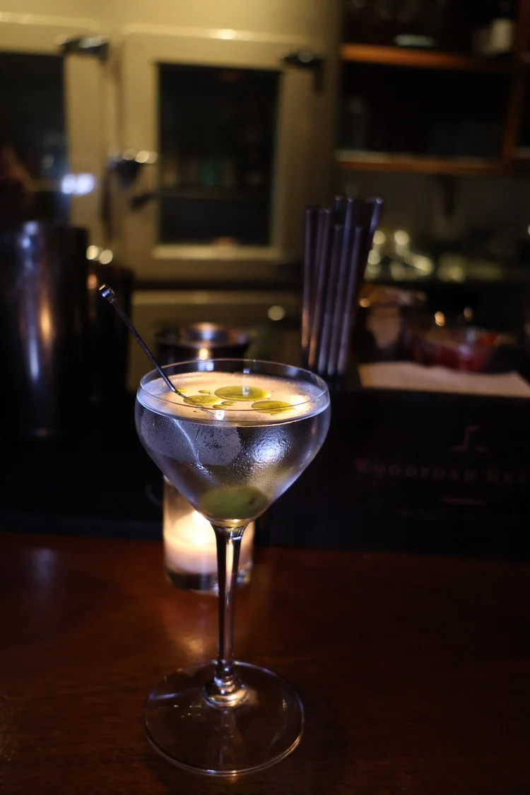 A martini with a citrus garnish at Tavern Law's candlelit bar on Capitol Hill.