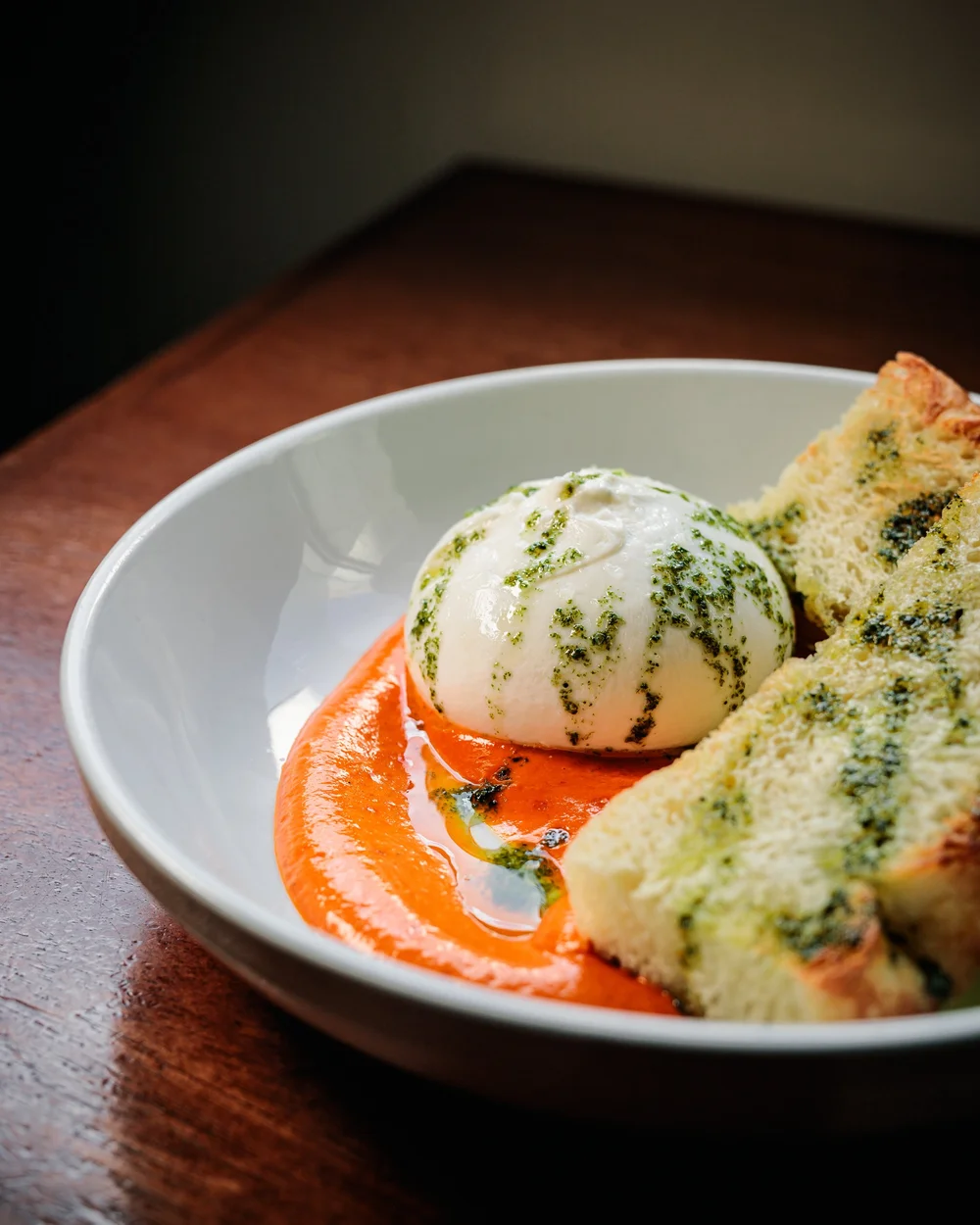 Burrata and focaccia with warm tomato and chile