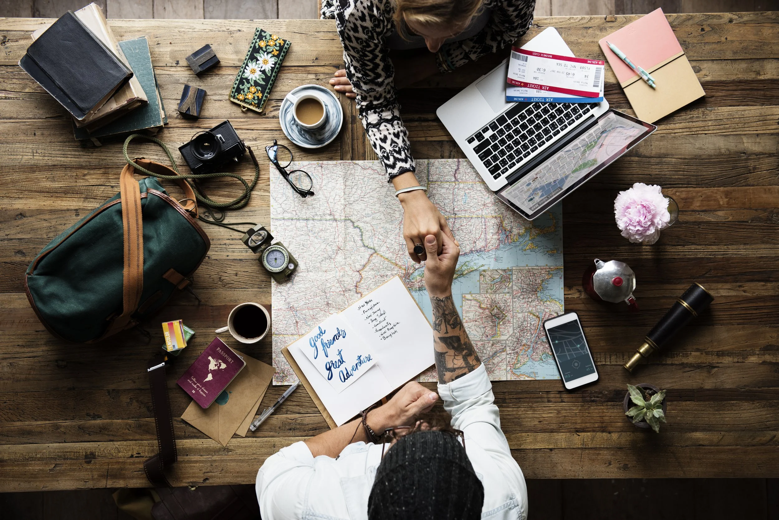 aerial-view-of-man-holding-woman-hand-over-the-map-2025-02-10-12-15-19-utc.jpg