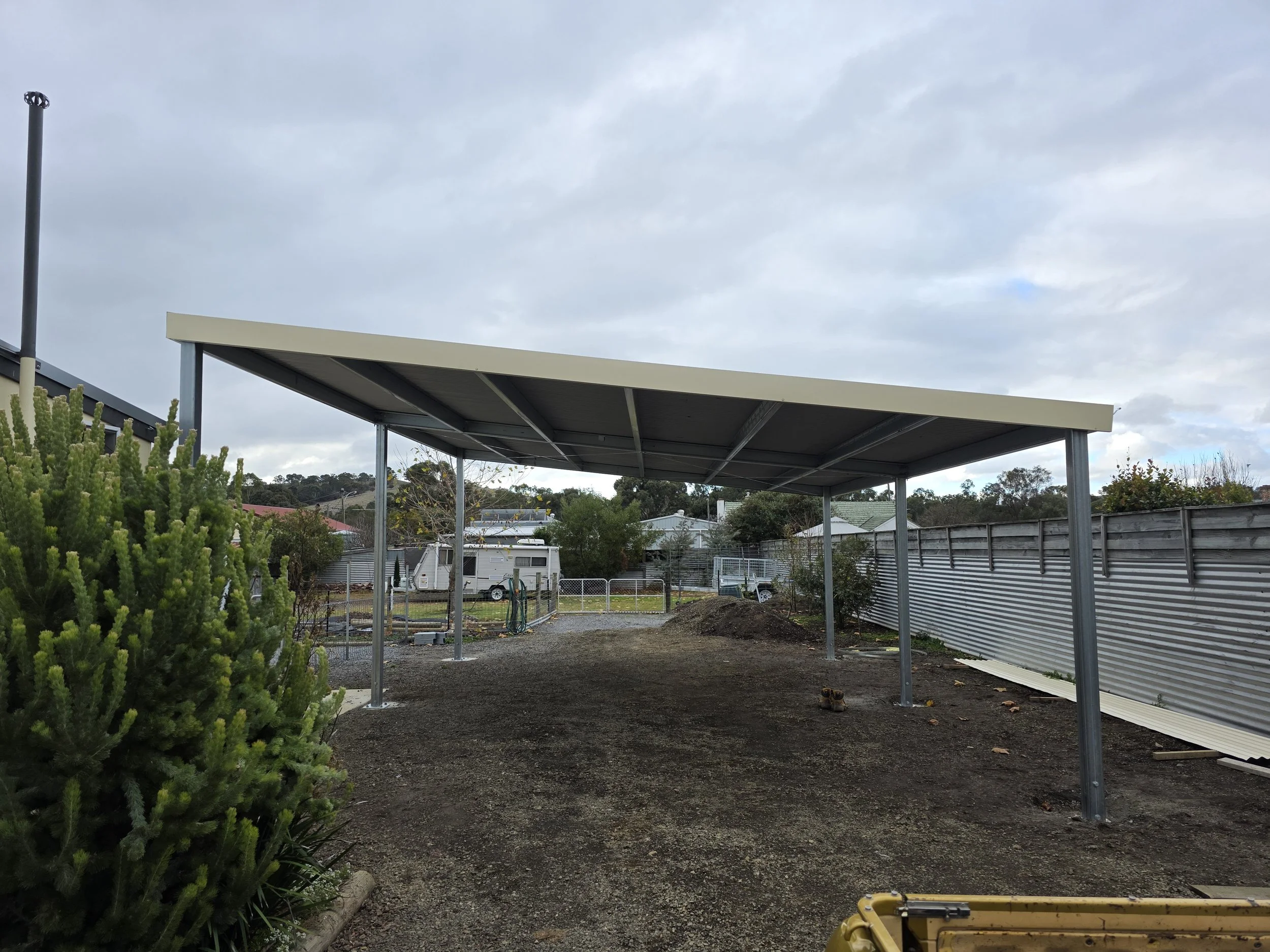 An outdoor carport shed built by M&C Sheds