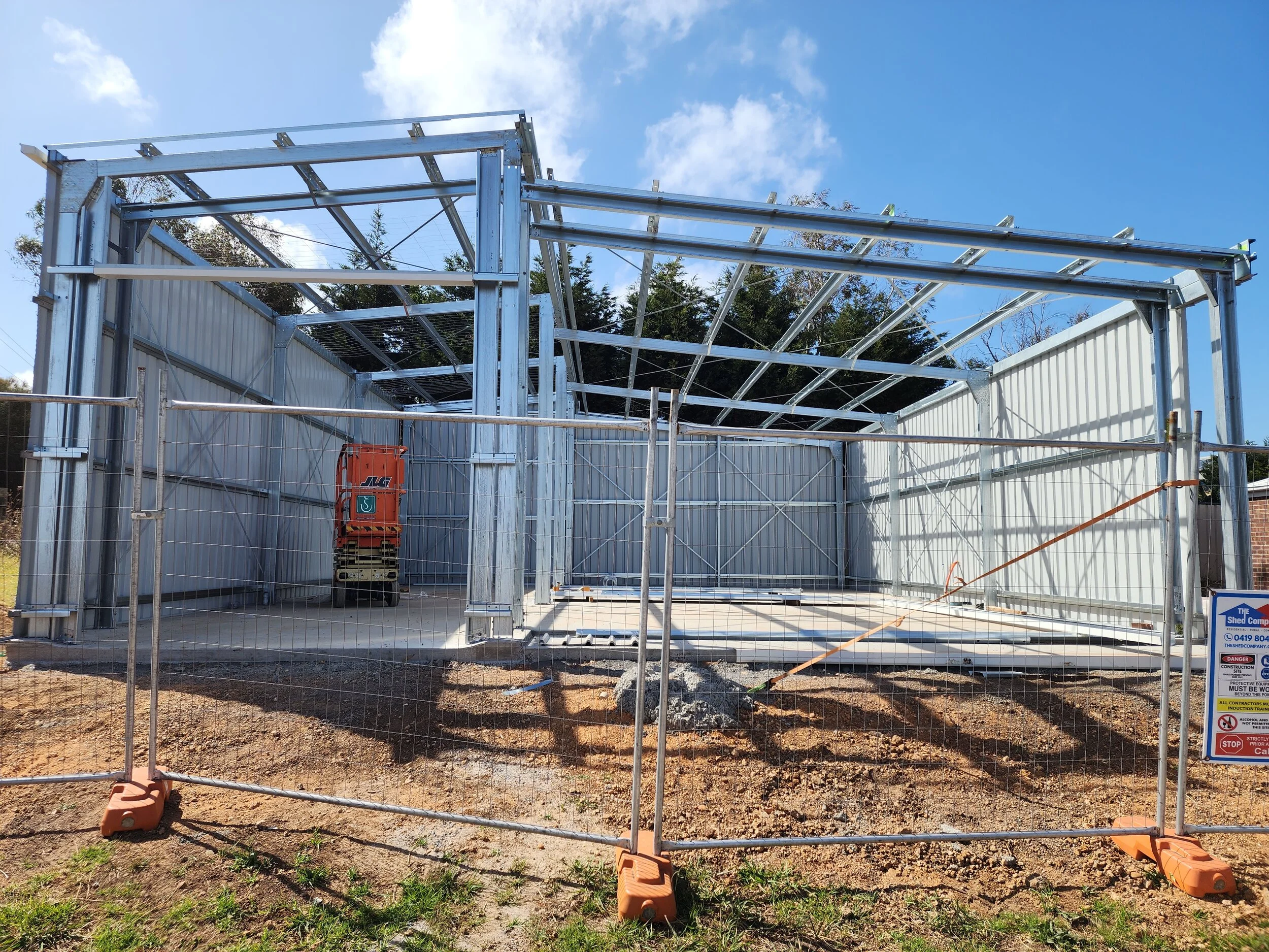 Metal framework and walls of a shed under construction