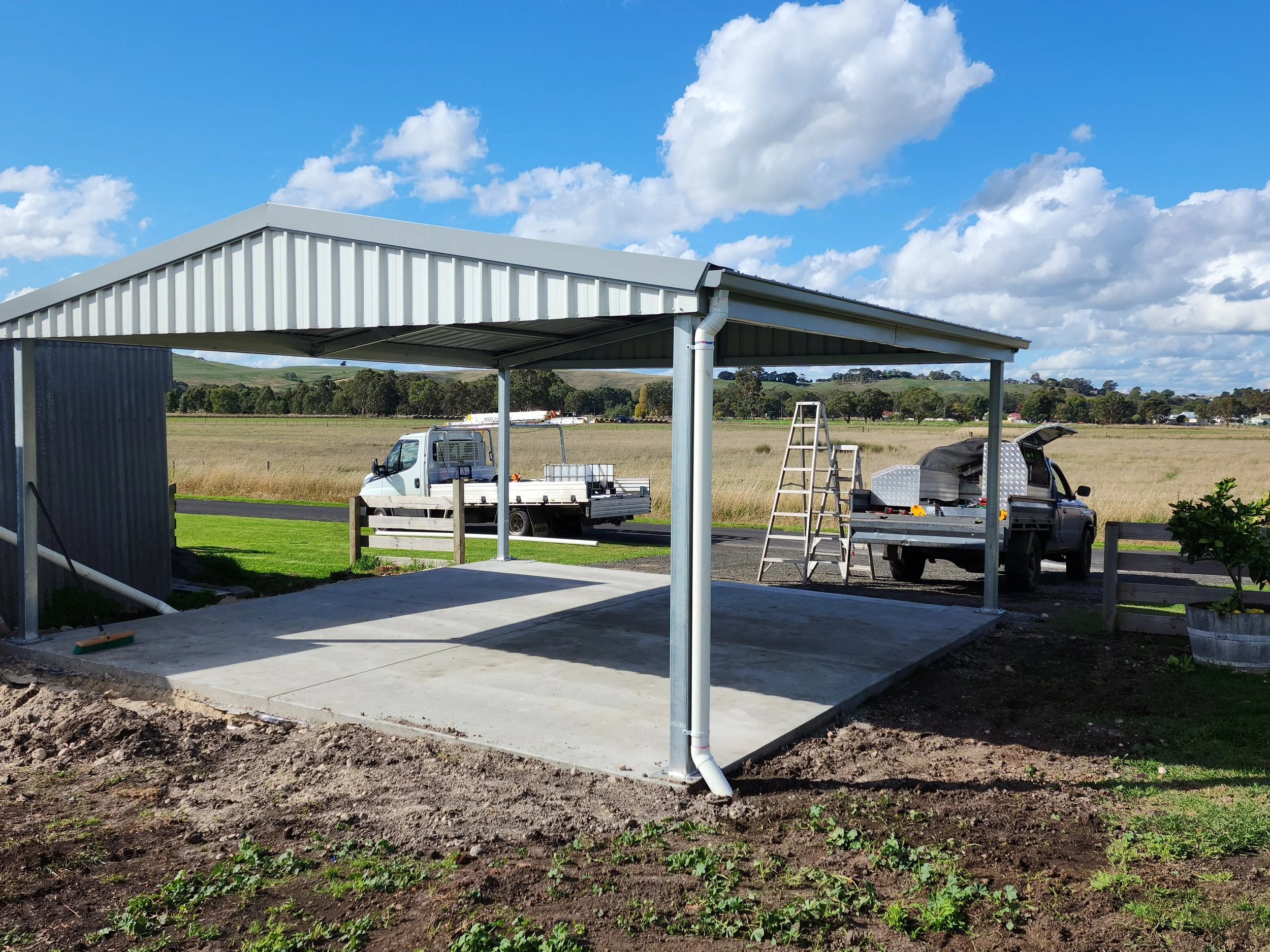 Newly constructed metal carport sheds with concrete slab, built by M&C Sheds