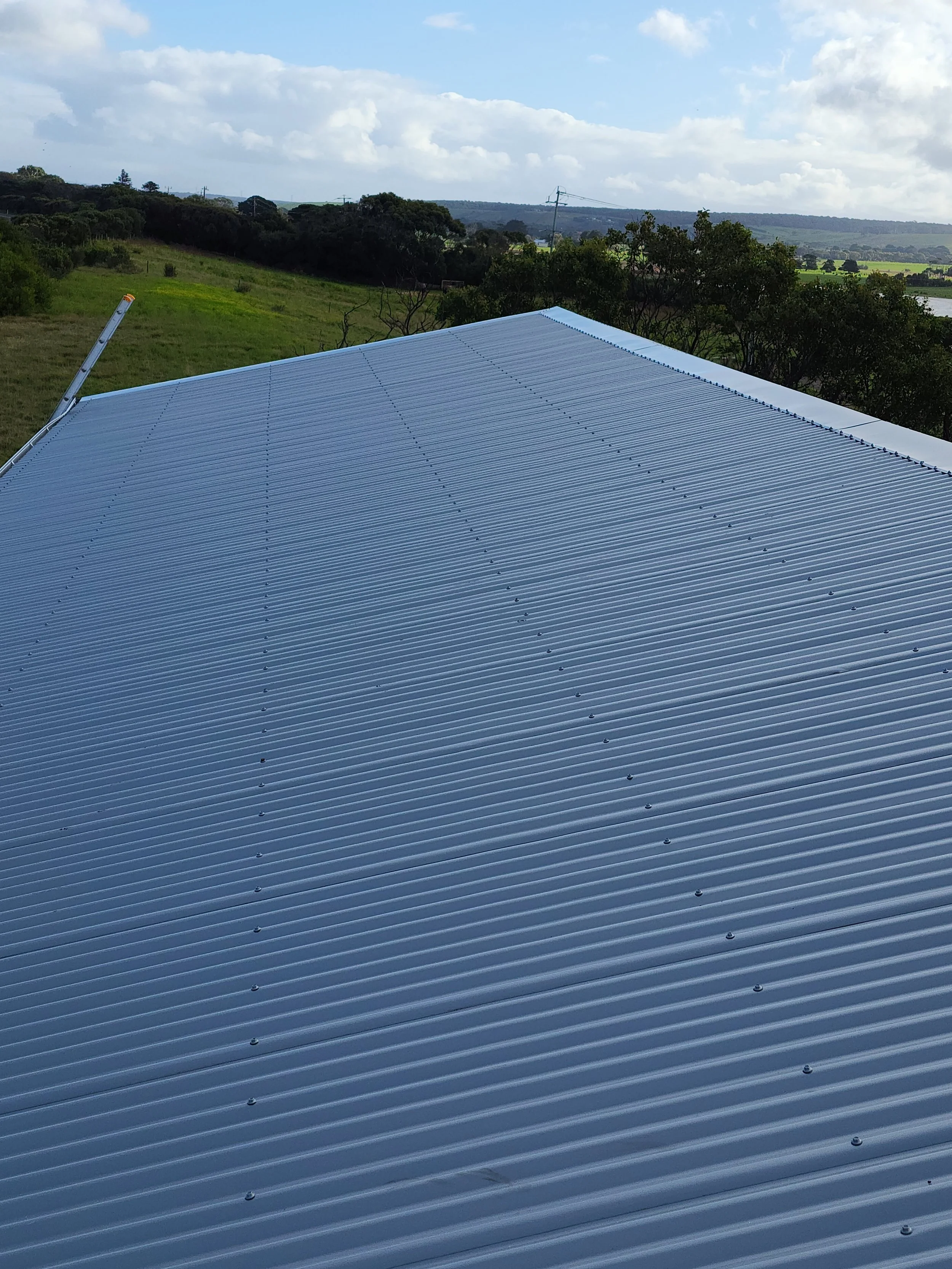 Close-up of a metallic, corrugated roof of a shed, built by M&C Sheds