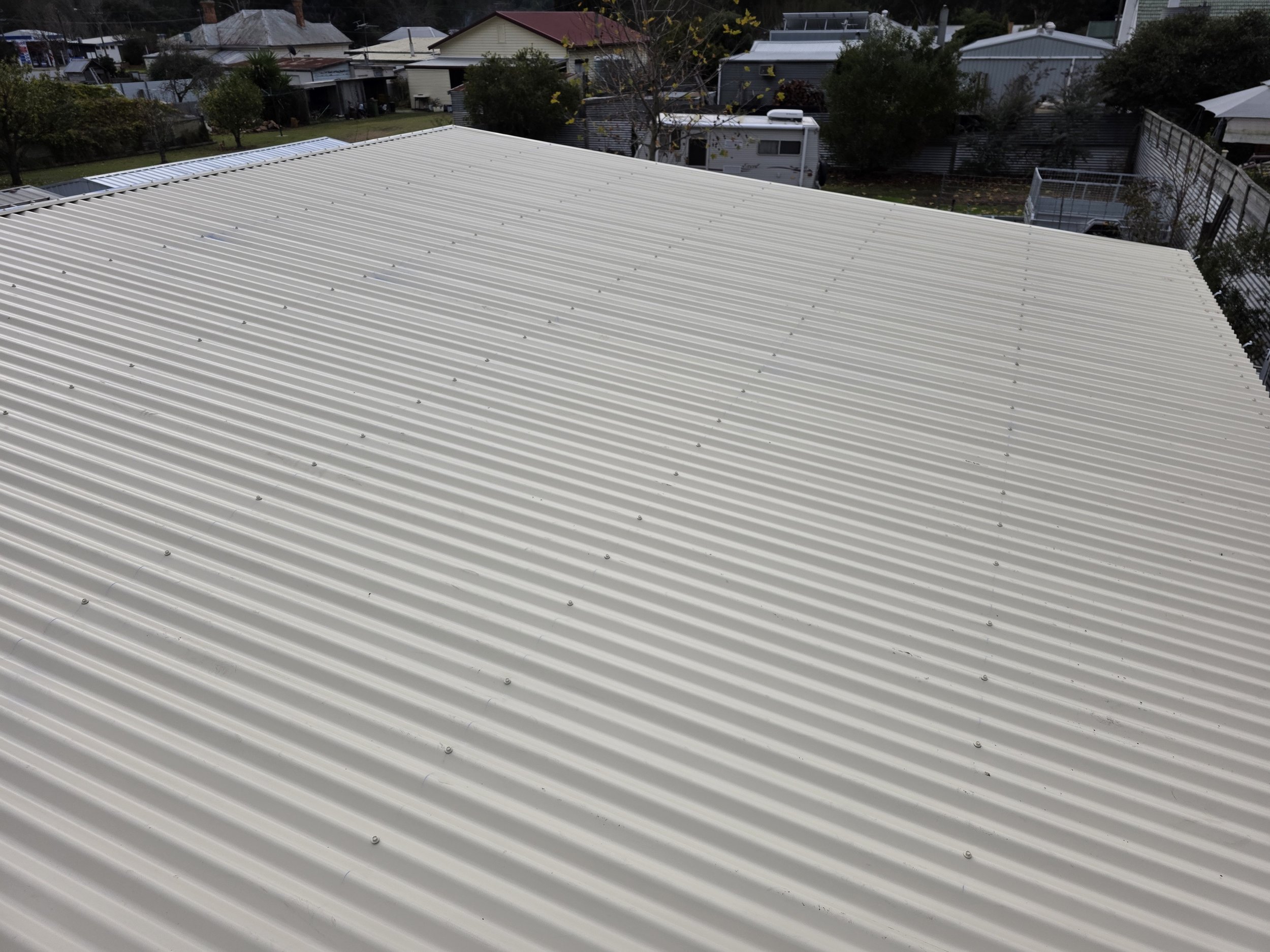 A large beige metal roof for shed built by M&C Sheds