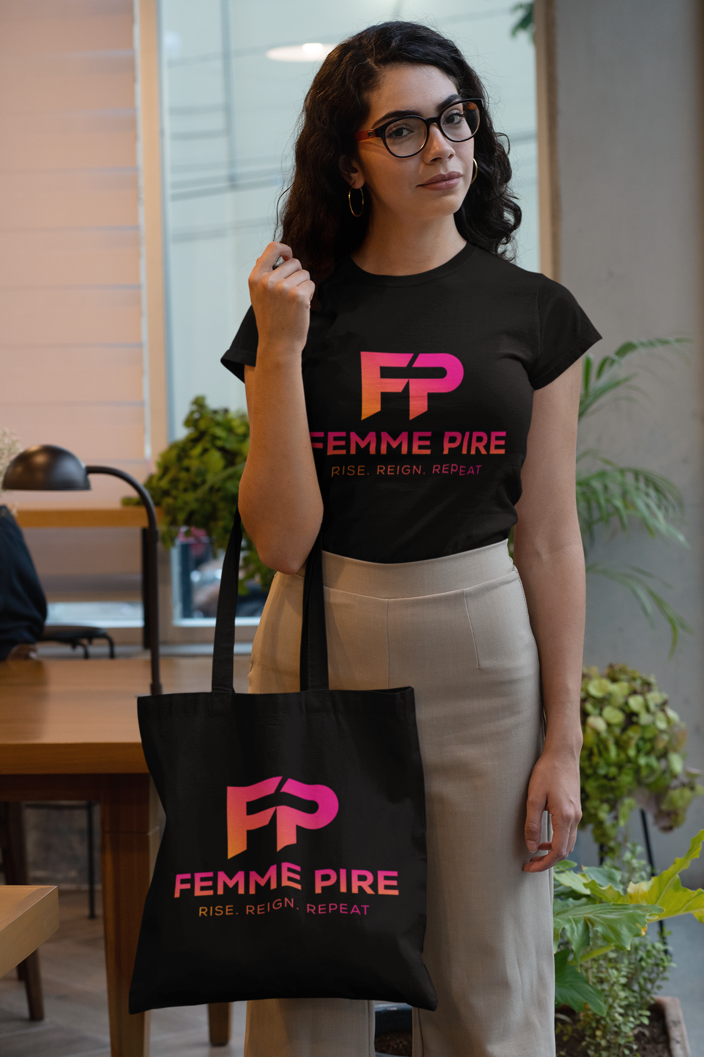 t-shirt-mockup-of-a-woman-holding-a-tote-bag-at-an-office-29413 (1).png