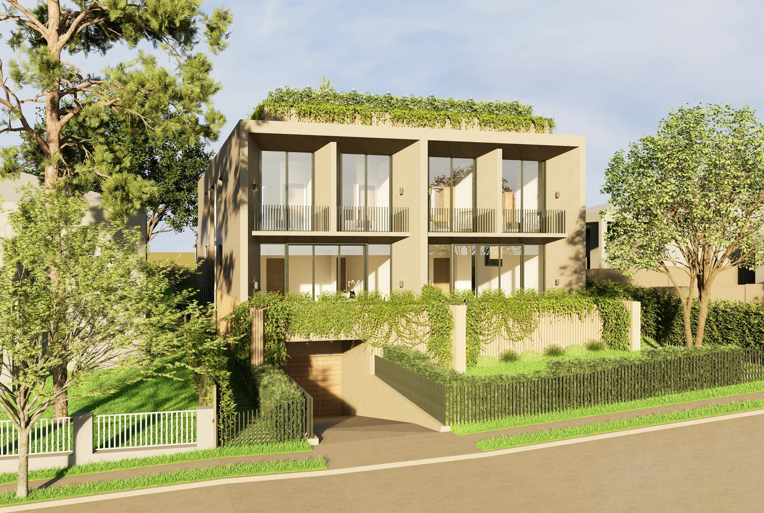 Modern multi-story residential building with large glass windows, surrounded by lush greenery and trees, with a fenced yard and pathway leading to an underground garage entrance.