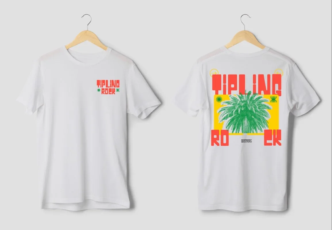 White T-shirt with a small red and green print on the front left chest reading 'TIPLING ROCK'. The back of the T-shirt features a large graphic with the word 'TIPLING' in red at the top, a yellow border, a green leafy plant in the center, and the word 'ROCK' in red at the bottom.