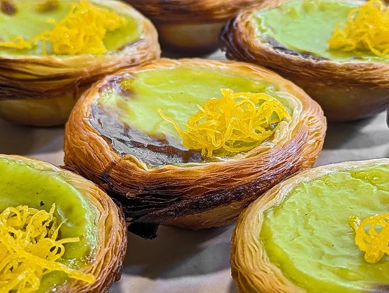 Small puff pastry tartlets topped with lemon curd and shredded lemon zest.