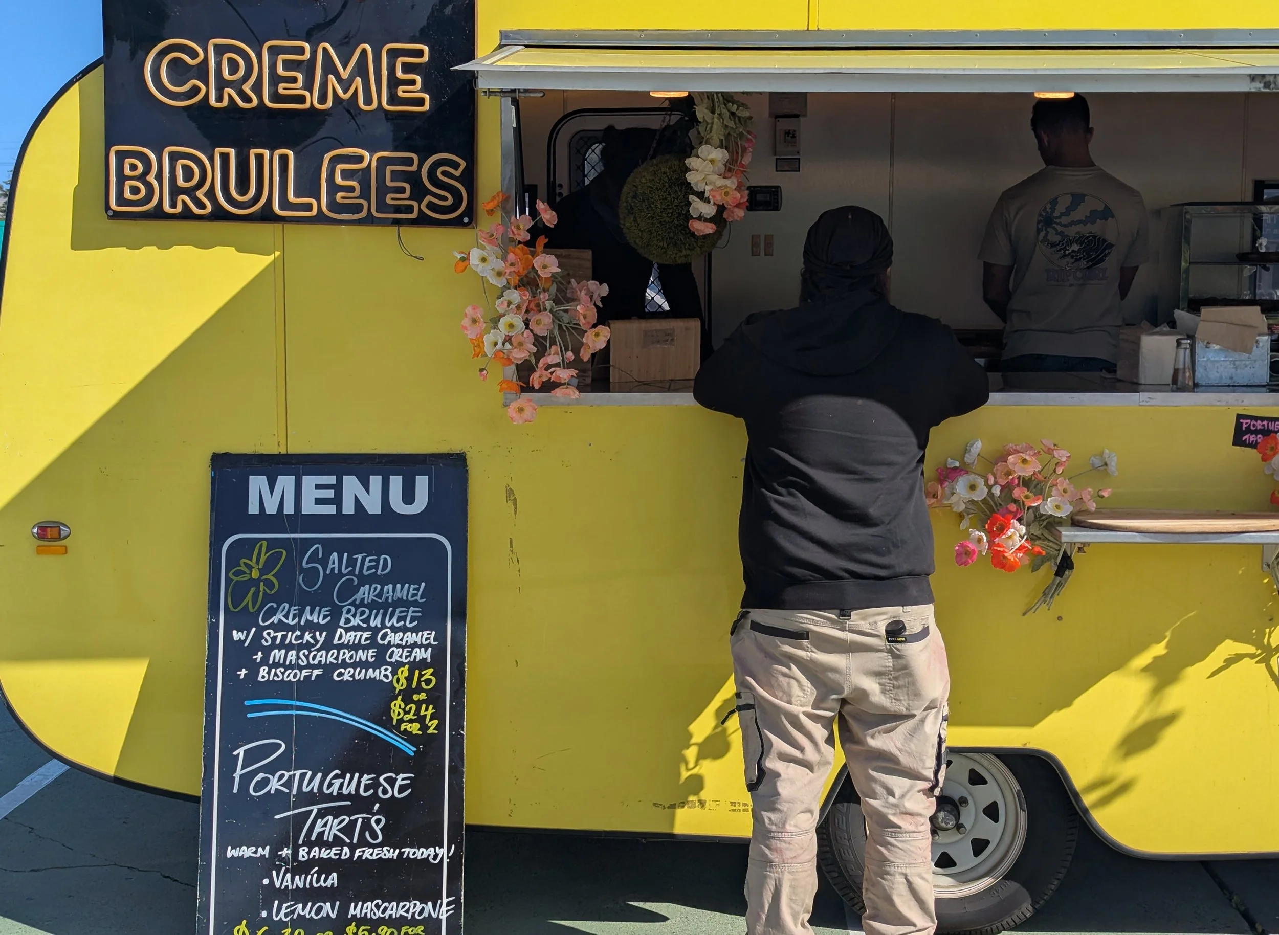 Man getting served at a food van