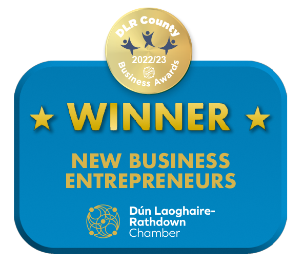 A blue and gold award badge for the DLR County Business Awards 2022/23, recognizing Dún Laoghaire-Rathdown Chamber as the winner in the New Business Entrepreneurs category.