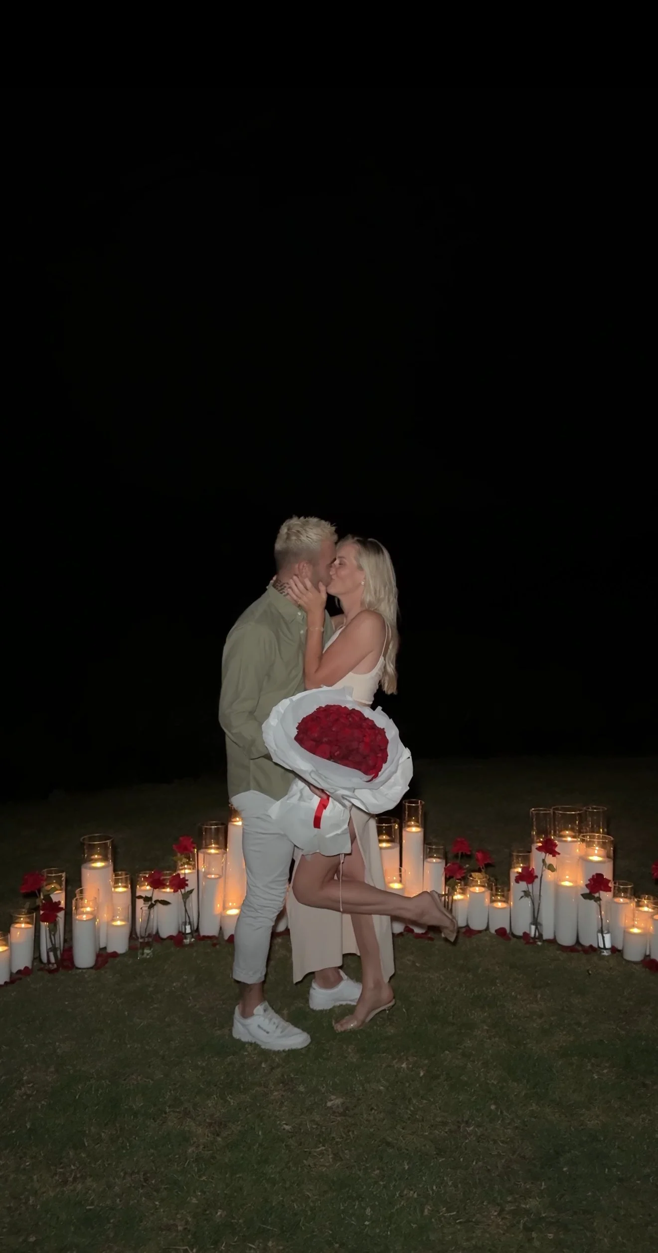 Couple enjoying a luxury lakeside proposal in Red Hill arranged with refined and opulent styling