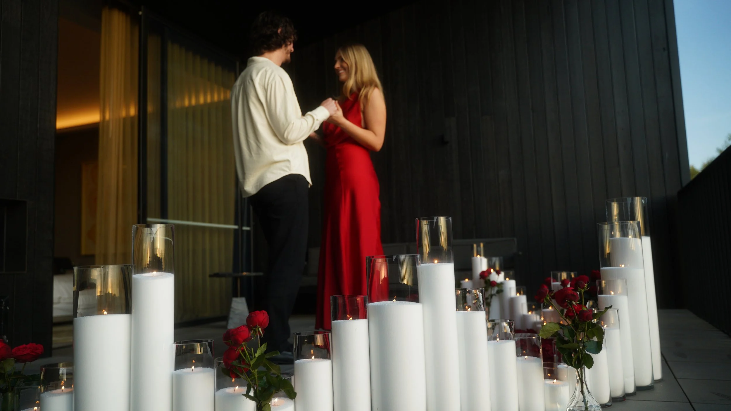 Opulent proposal set up in Melbourne featuring candles, florals and luxury decor for a romantic engagement. 