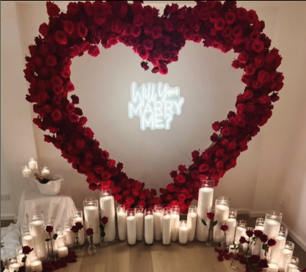 Luxury styled proposal experience featuring a red rose heart arbour and candlelight in Melbourne