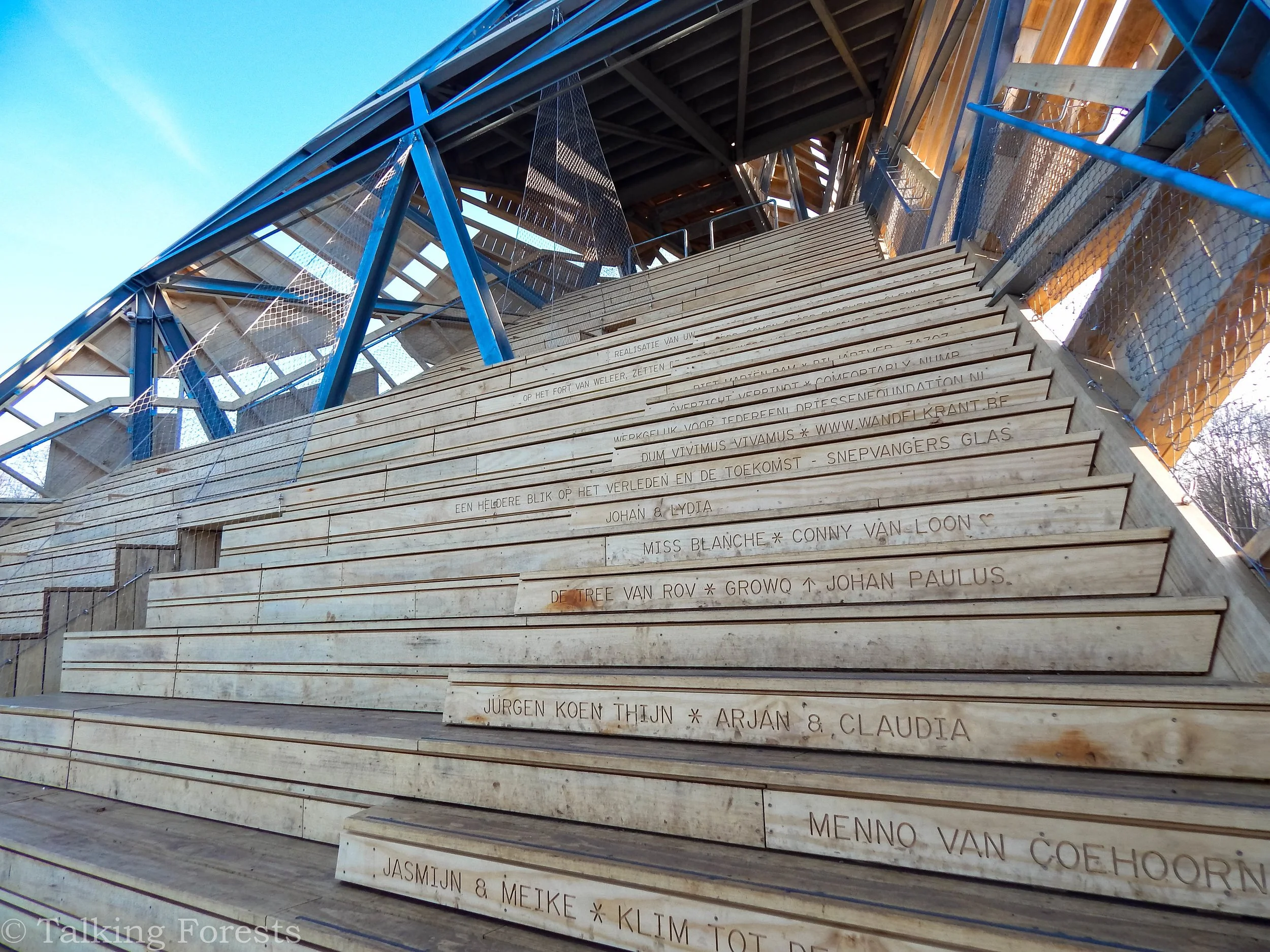 Mass Timber and steel is a hybrid structure with steps made of wood and carved names of people and companies in the steps going up towards the top of the tower.