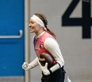 A stylized blue and white logo of a fierce-looking panther's head.