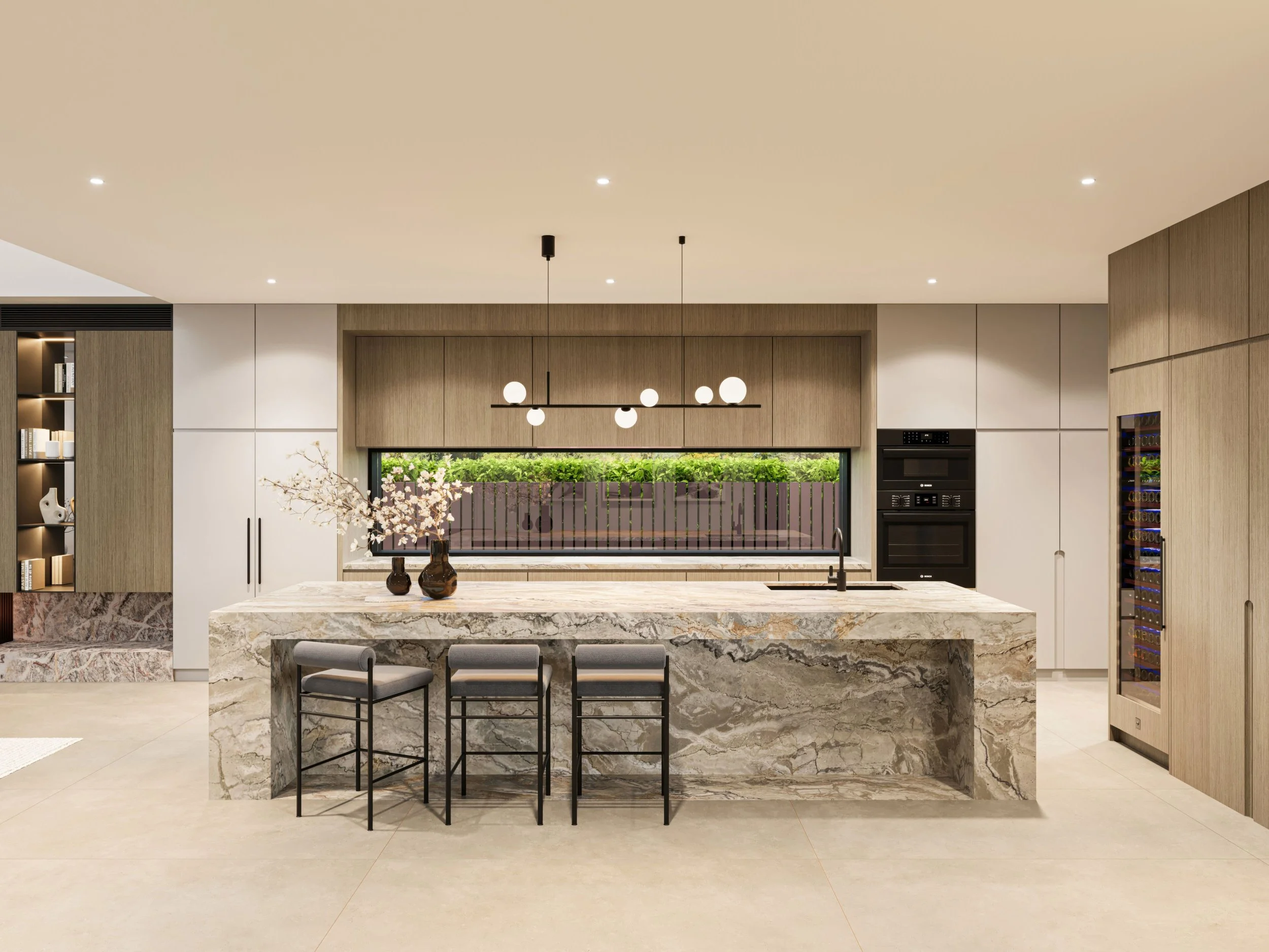 Modern kitchen with a marble island, bar stools, pendant lighting, and built-in appliances.