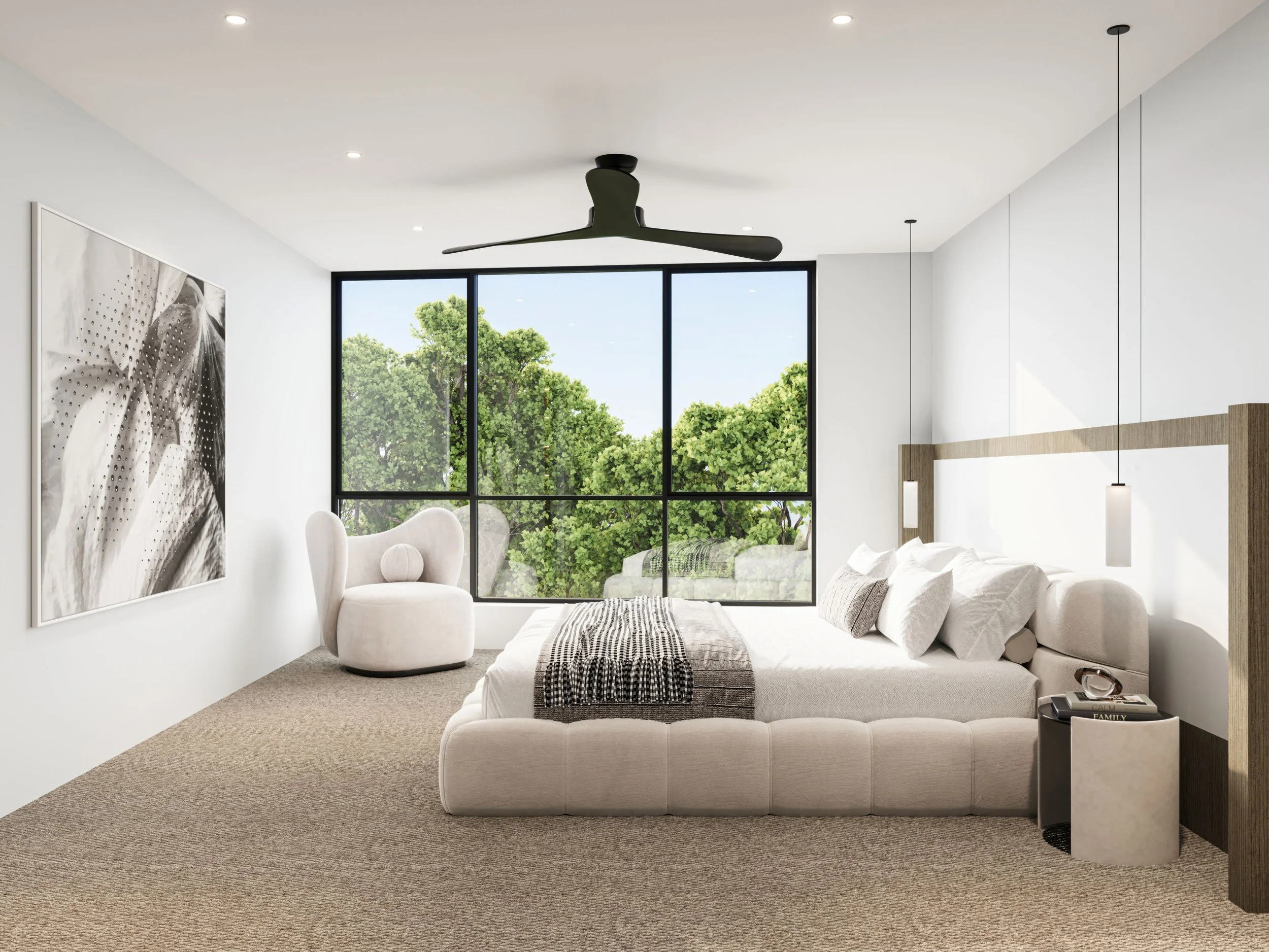 Modern bedroom with large window showing green trees outside, white bed with pillows and blanket, black bedside table, abstract wall art, white armchair, ceiling fan, and hanging pendant lights.